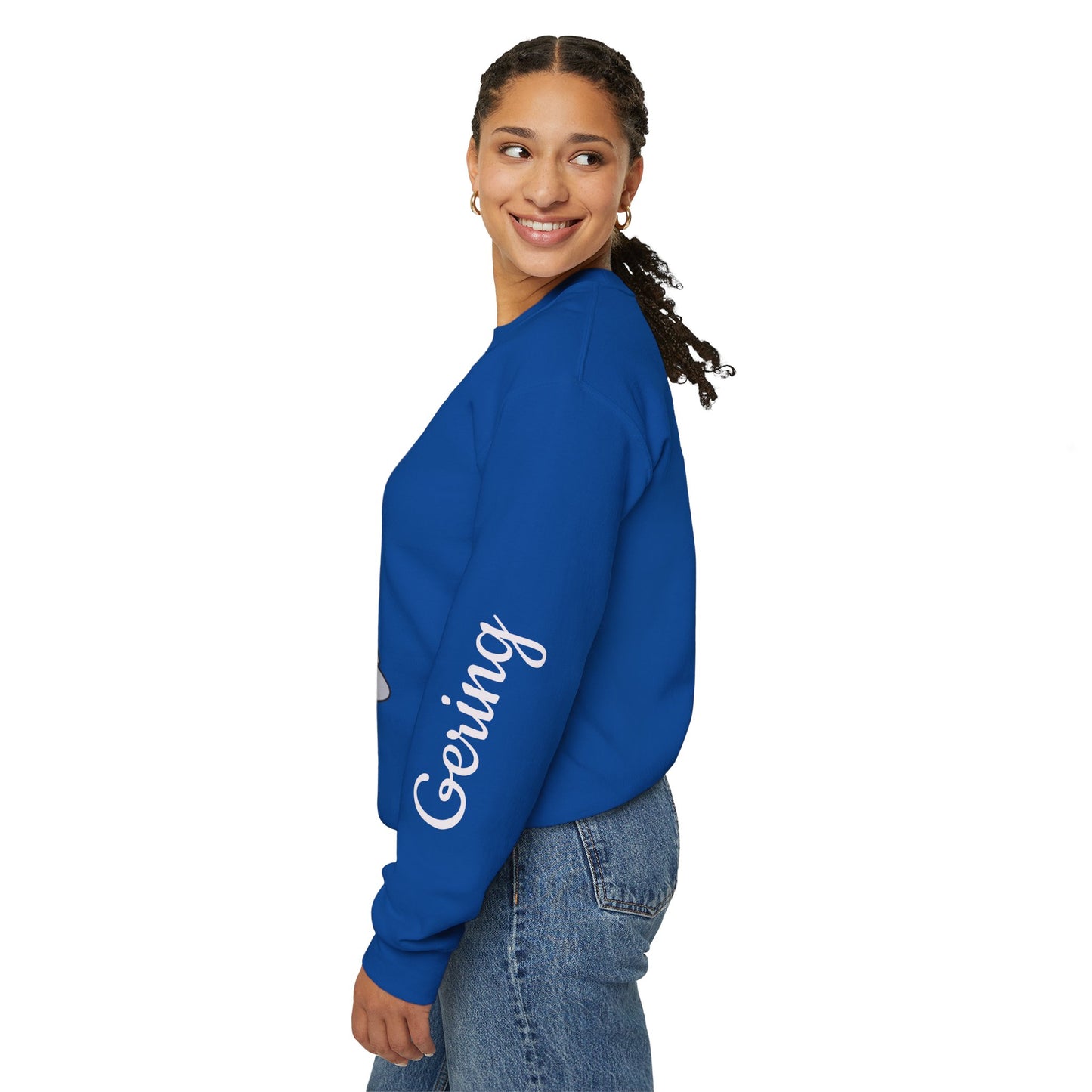 Royal blue crewneck sweatshirt, side view, with white “Gering” text on the sleeve