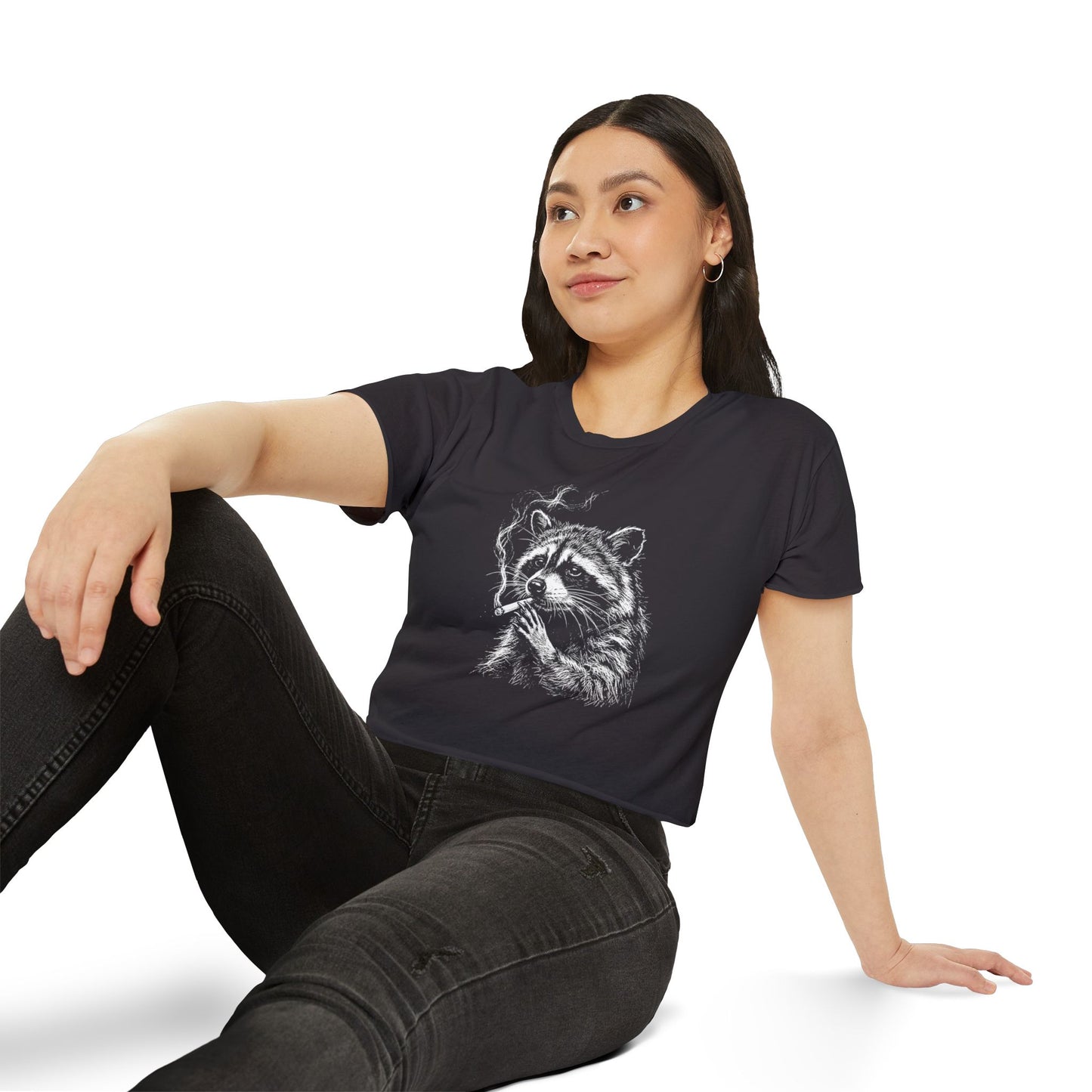 Black short-sleeve crop top with white raccoon graphic worn by model