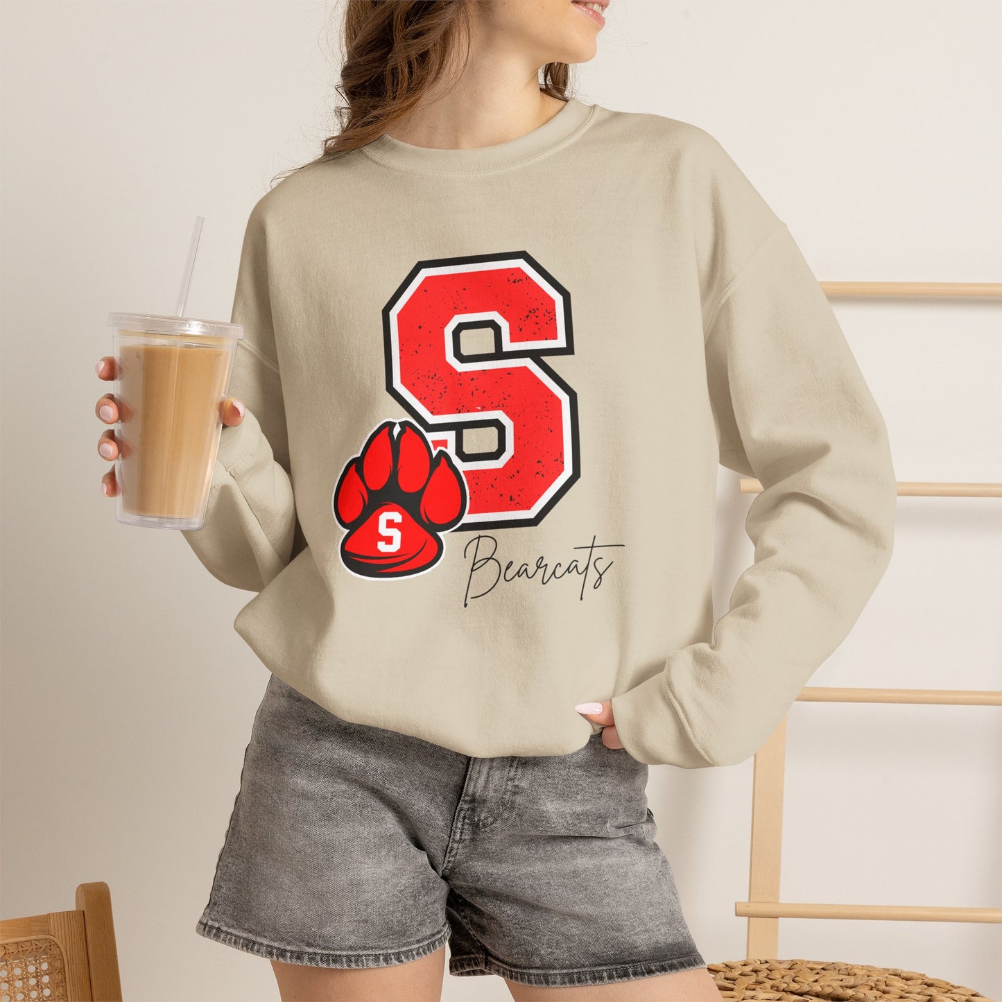 Sand crewneck sweatshirt with red S paw graphic and Bearcats logo on front