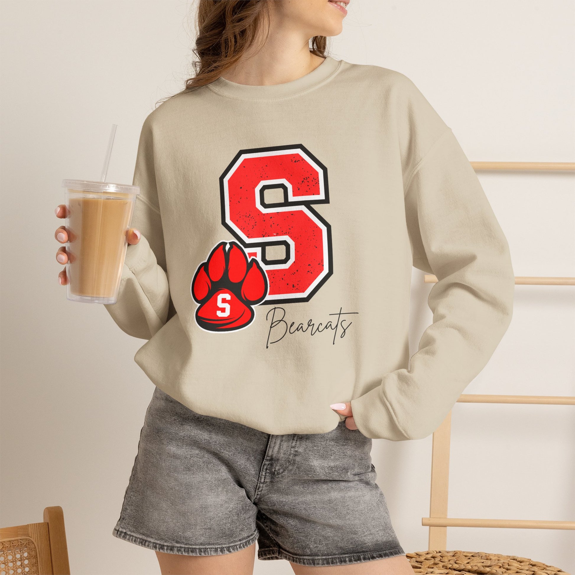 Sand crewneck sweatshirt with red S paw graphic and Bearcats logo on front