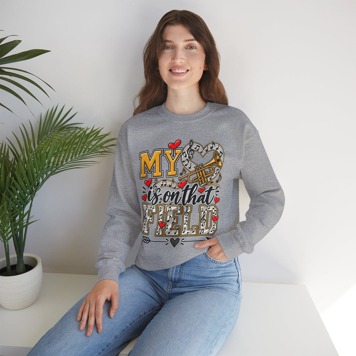 Grey sweatshirt worn with front trumpet graphic and “My” lettering with hearts