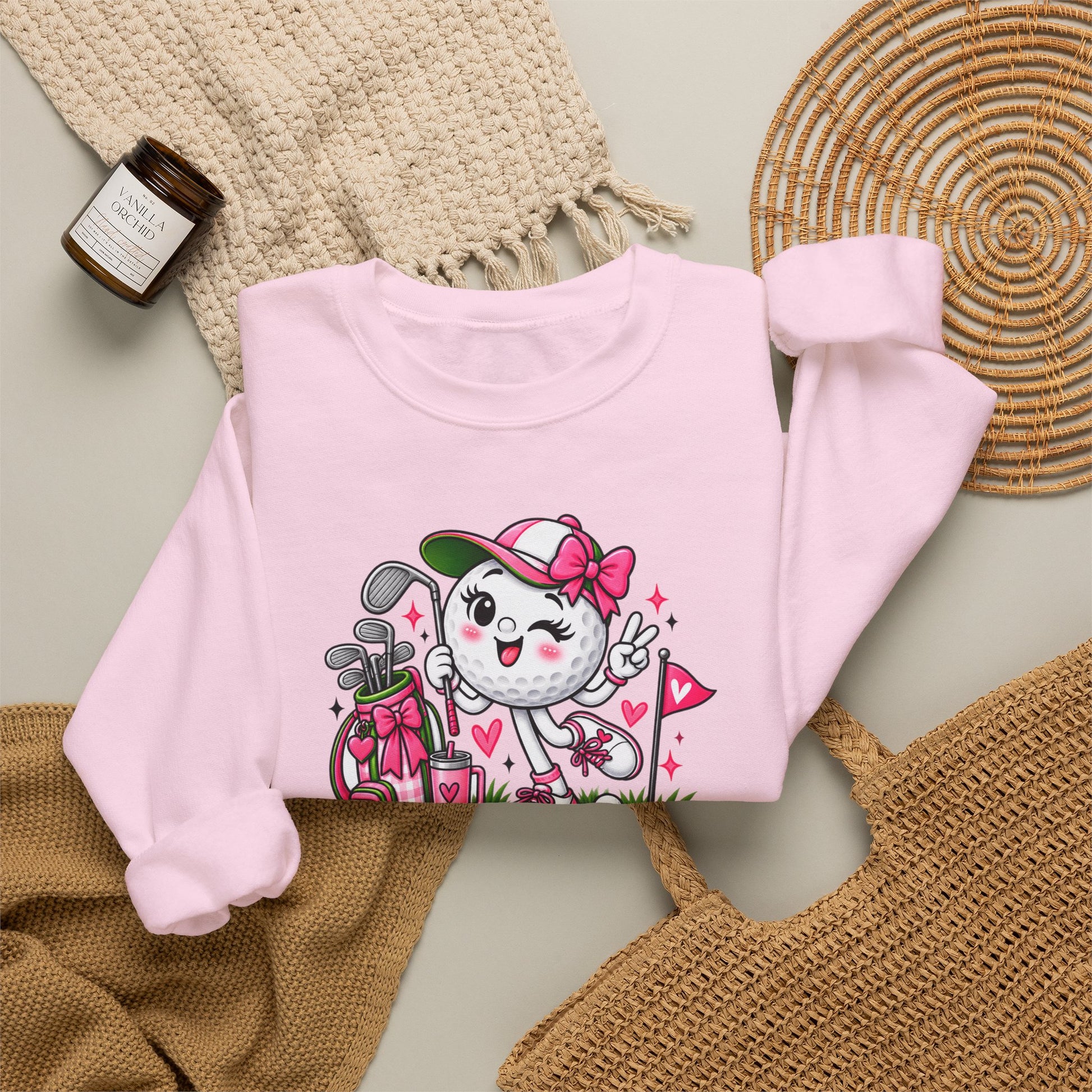 Pink crewneck sweatshirt with colorful golf-ball character graphic on front