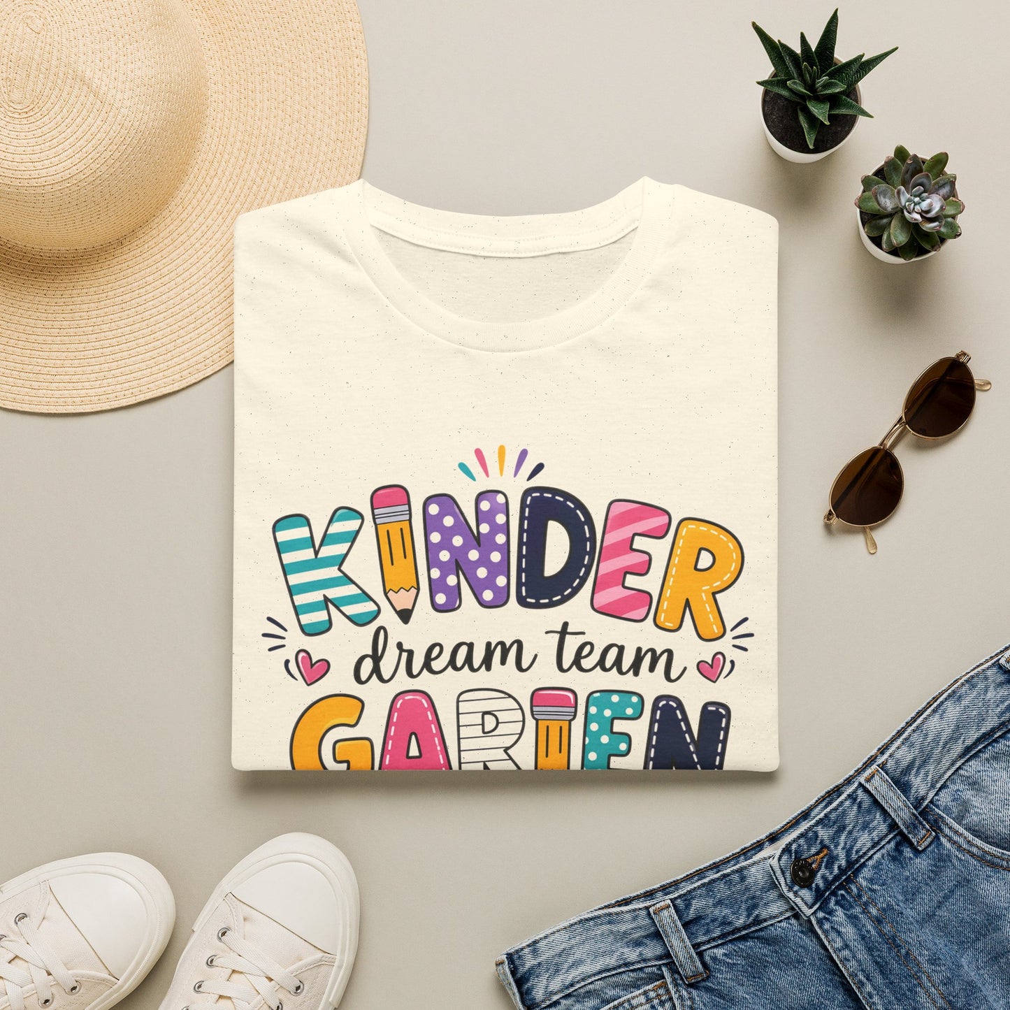 White kids graphic T-shirt with colorful "KINDER" "dream team" "GARDEN" print