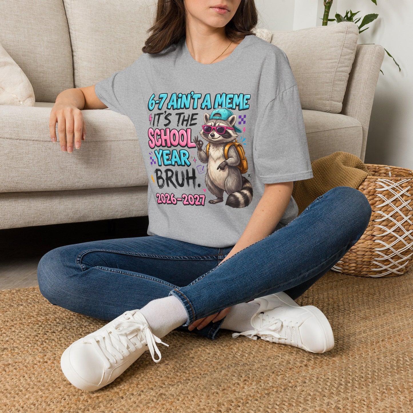 Sport grey raccoon back-to-school T-shirt, worn front view with school-year graphic