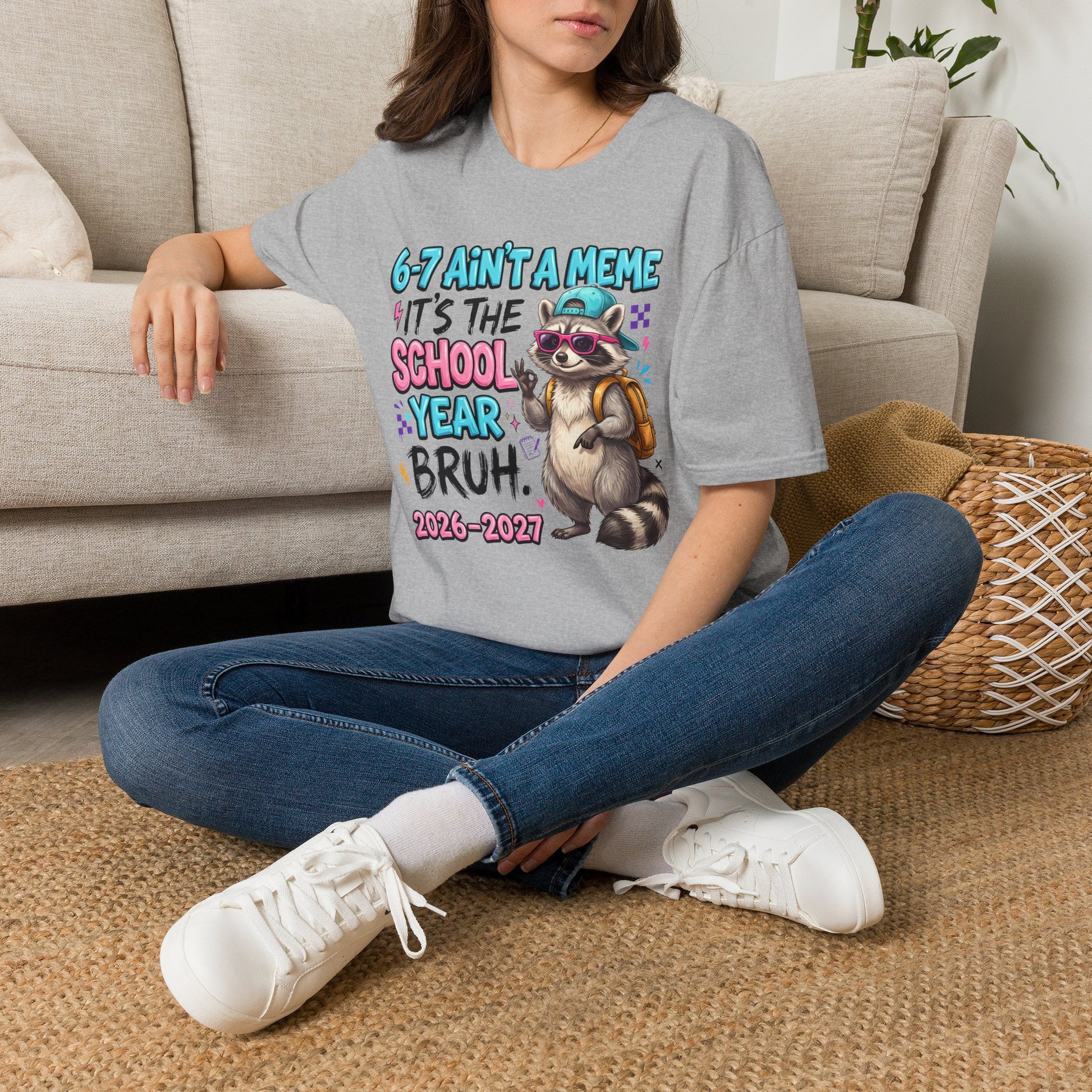 Sport grey raccoon back-to-school T-shirt, worn front view with school-year graphic