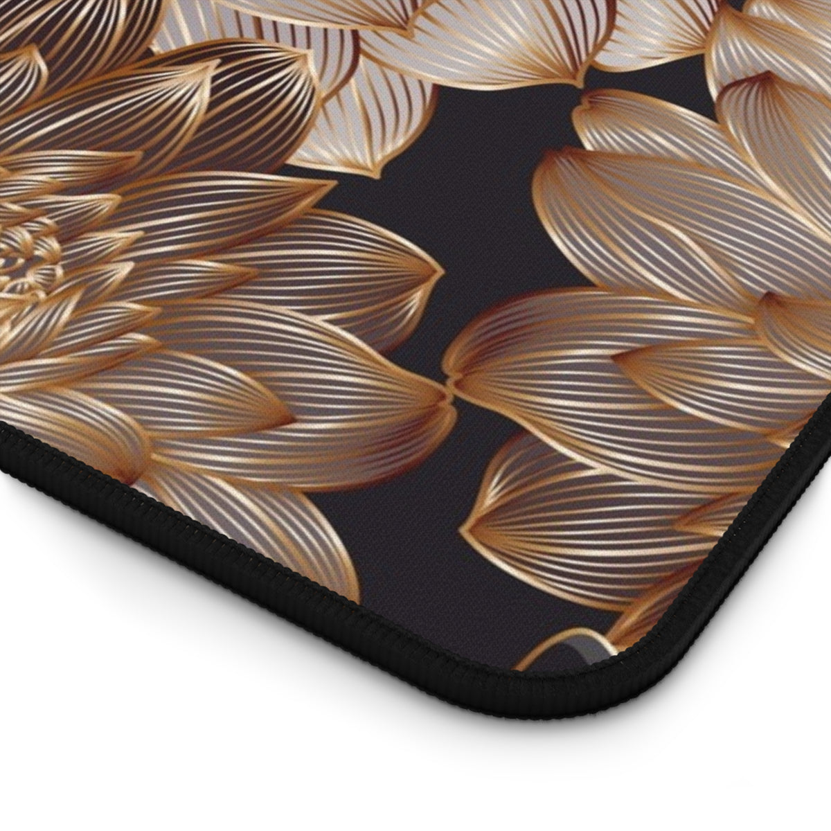 Large desk mat with gold leaf floral pattern and black stitched edge