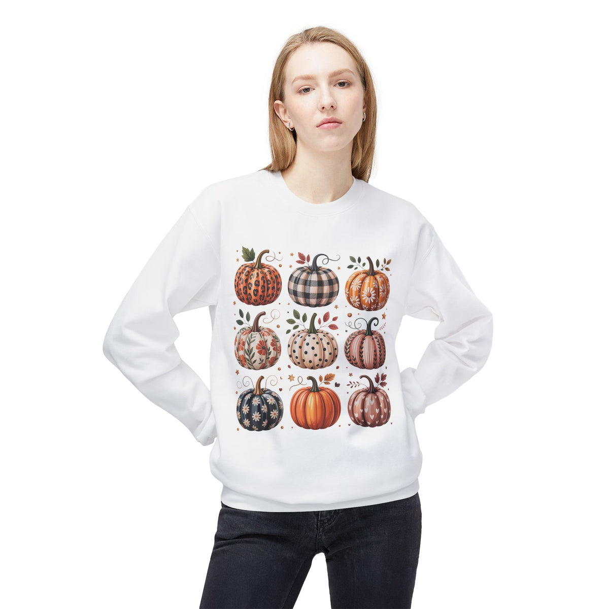 White crewneck sweatshirt worn by a model with patchwork pumpkin front graphic