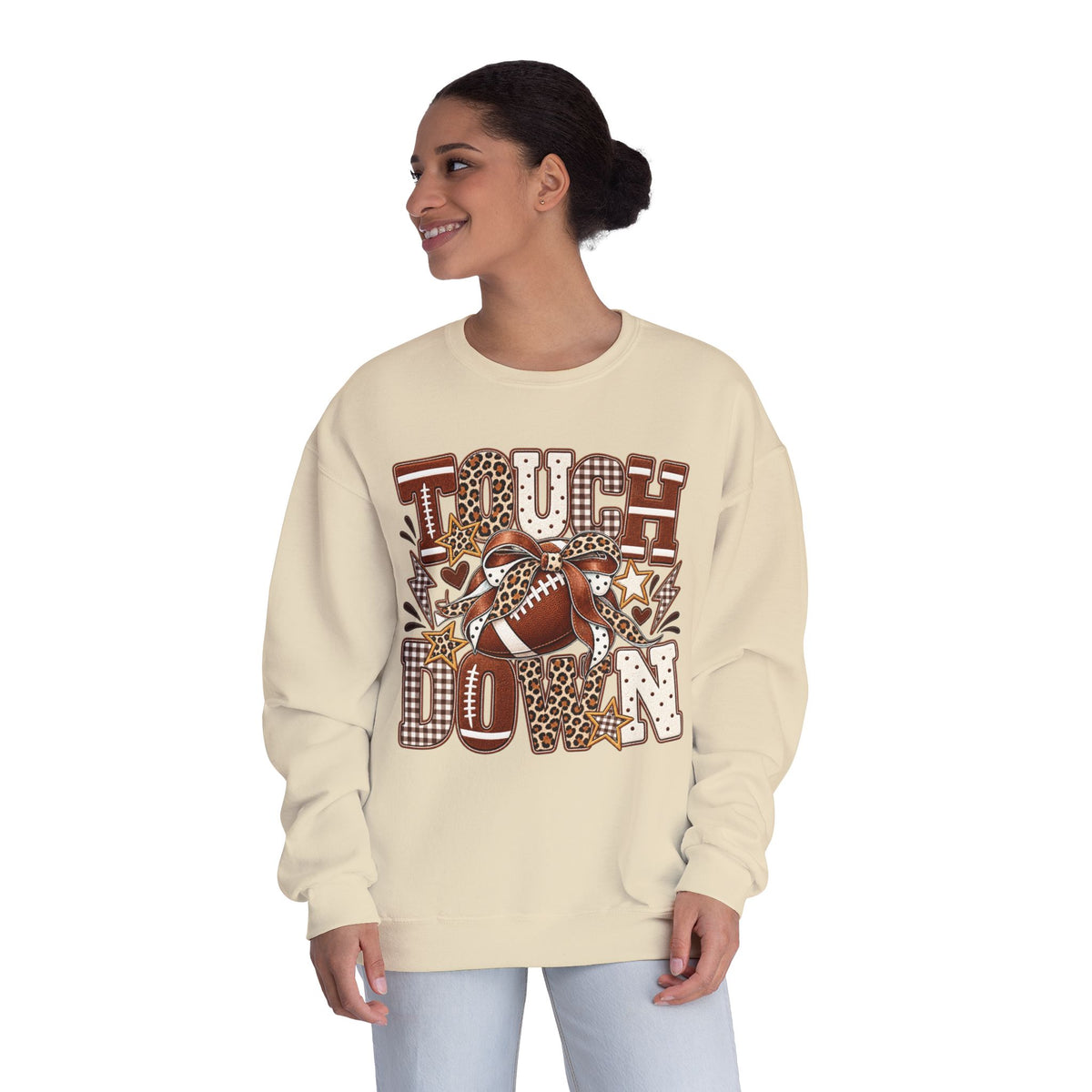 Sandstone crewneck sweatshirt on model, front view with brown football “Touchdown” graphic