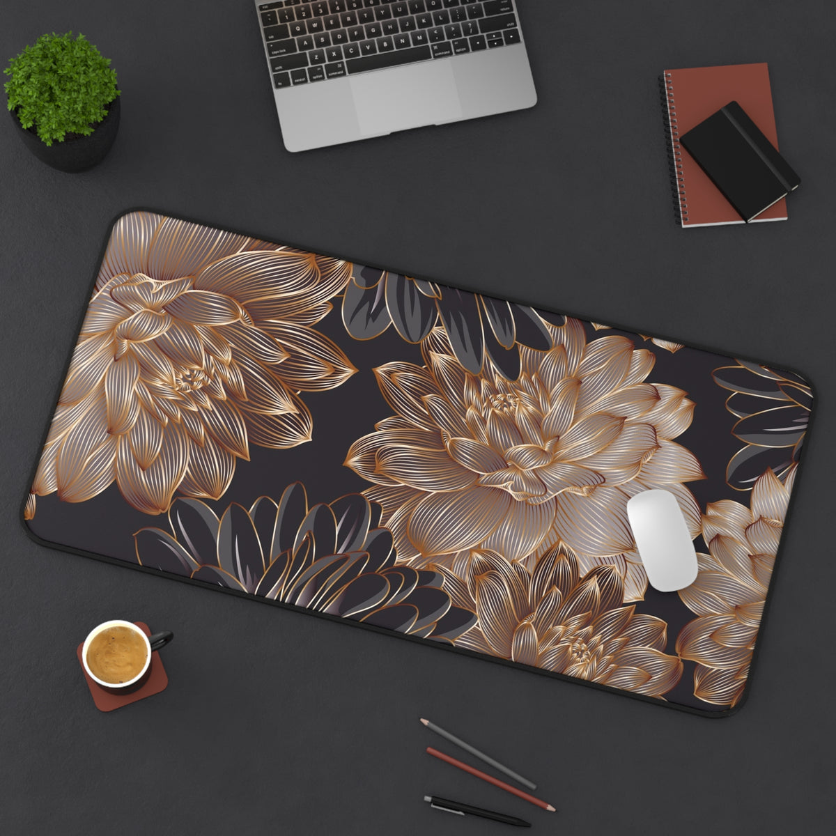 Large gold-and-black floral desk mat with rounded corners and stitched trim