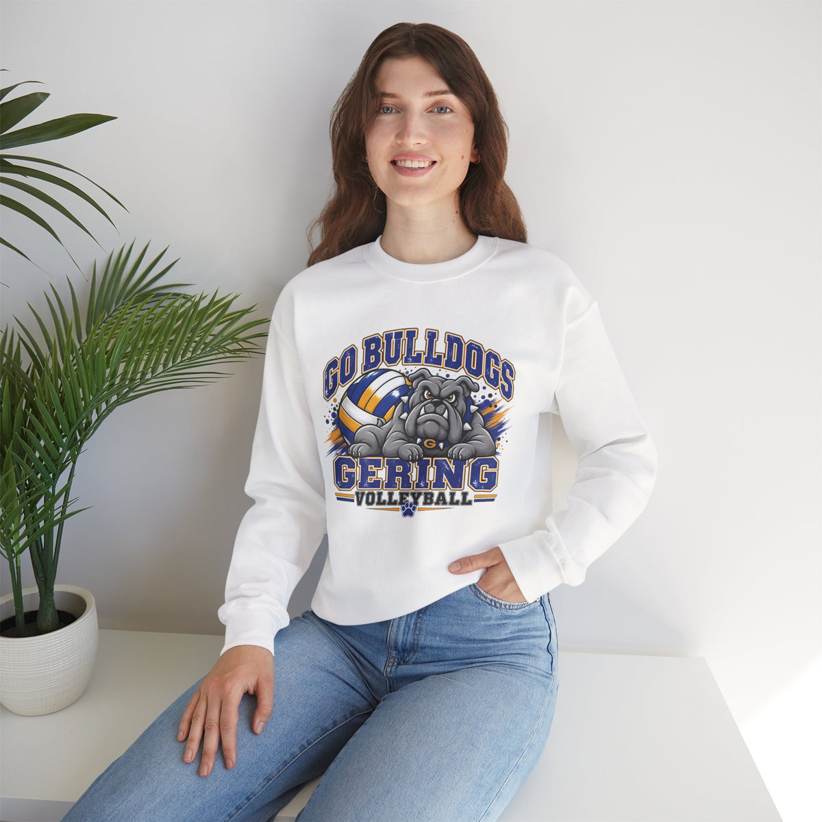 White crewneck sweatshirt on model, showing bulldog and volleyball team graphic