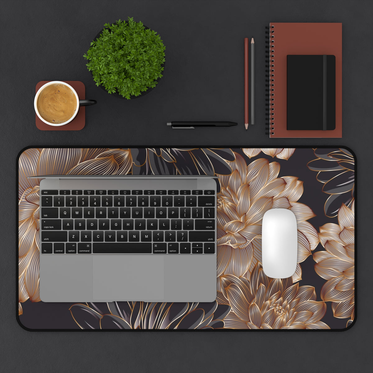Large floral desk mat with gold blossoms on dark base, rounded corners