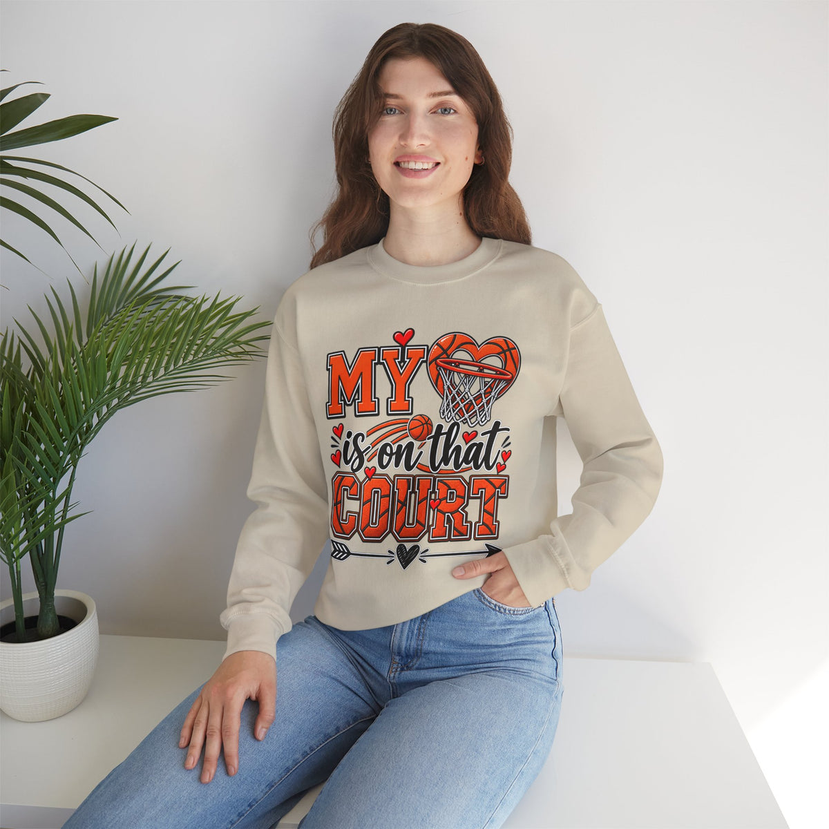 Light beige sweatshirt with basketball hoop and heart graphic on front