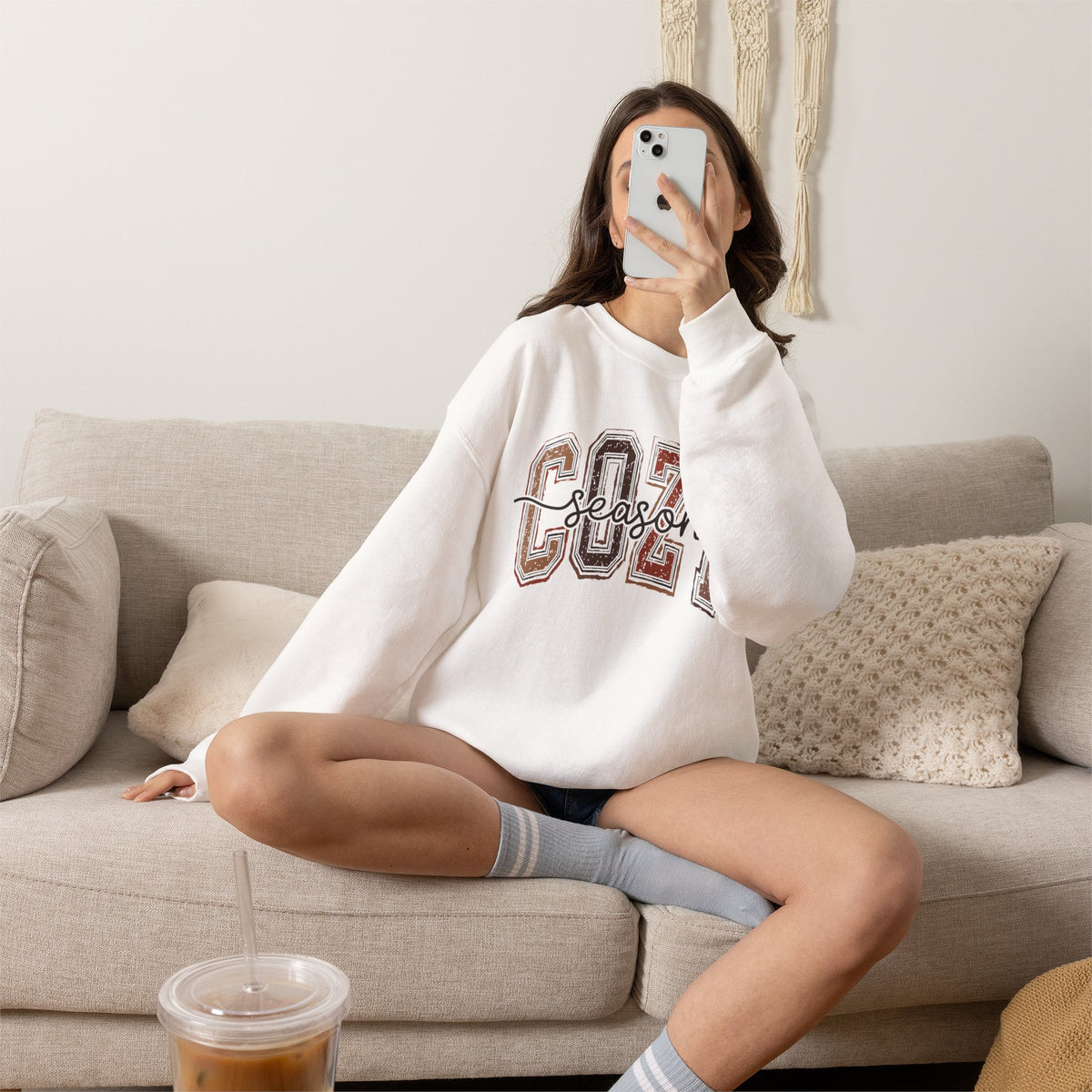White crewneck sweatshirt with Cozy Season graphic front, relaxed fit