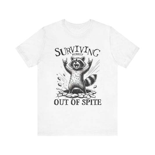 White unisex raccoon graphic tee with slogan “Surviving Out of Spite” on front