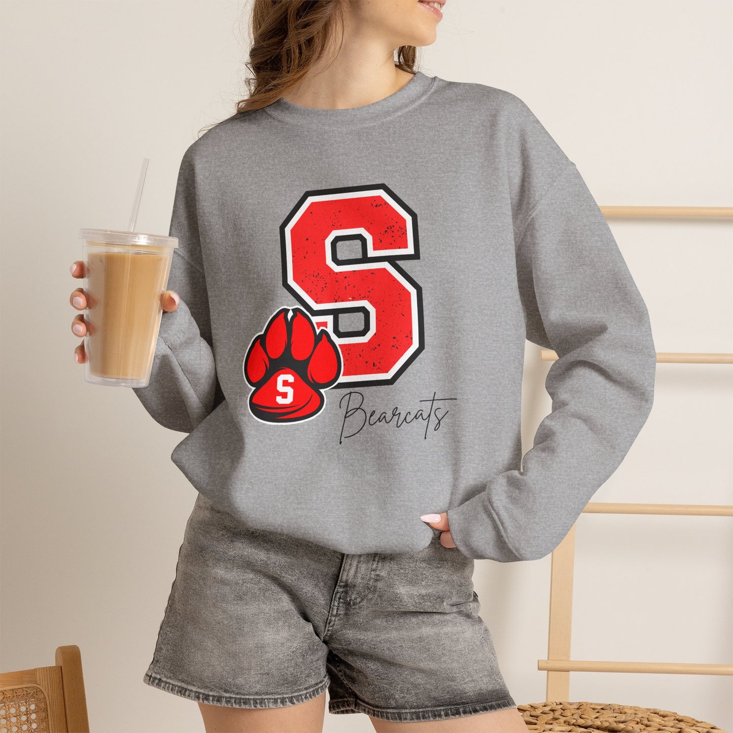 Heather gray crewneck sweatshirt with red varsity S and paw print graphic at center chest