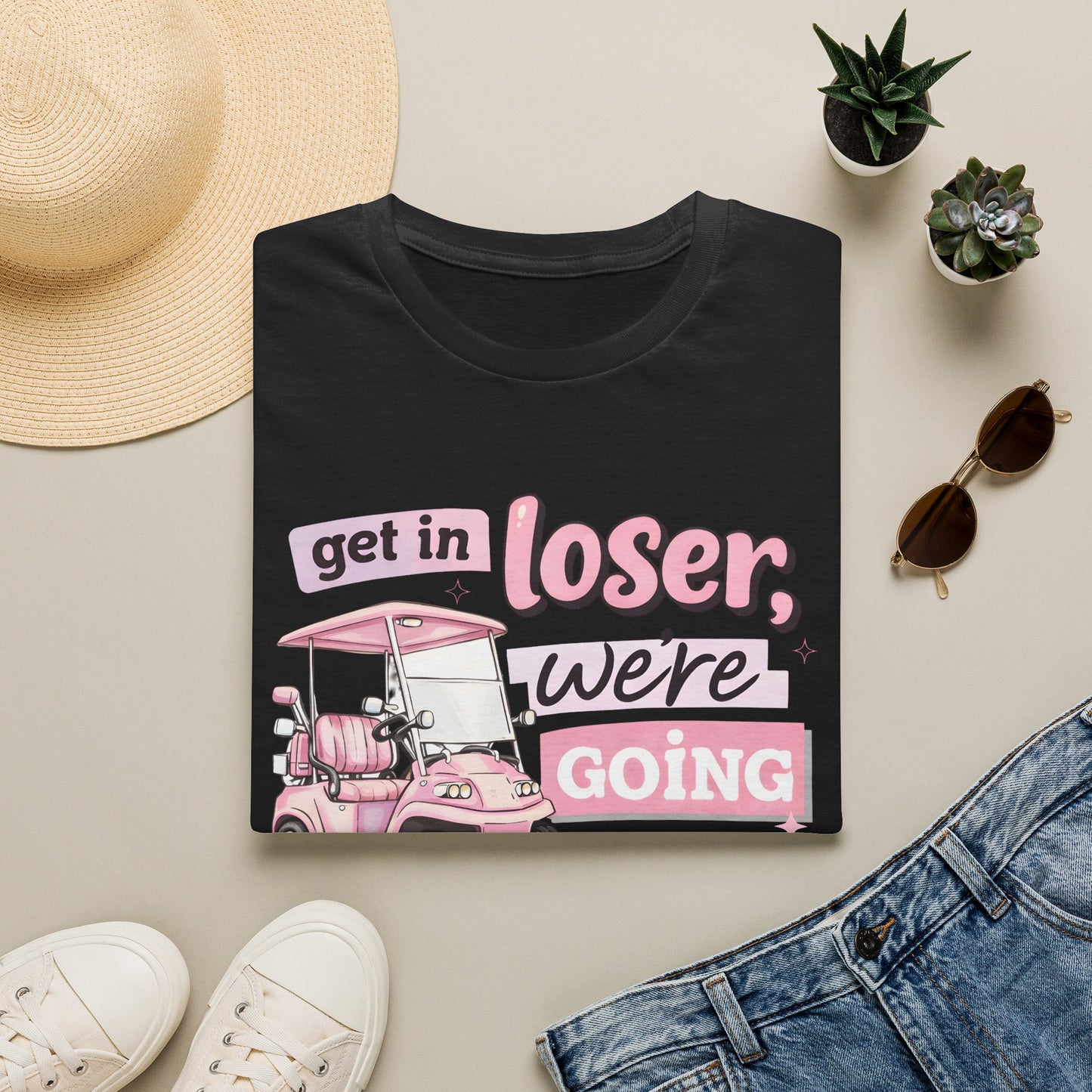 Black crewneck golfing graphic T-shirt with pink and purple “get in loser” print