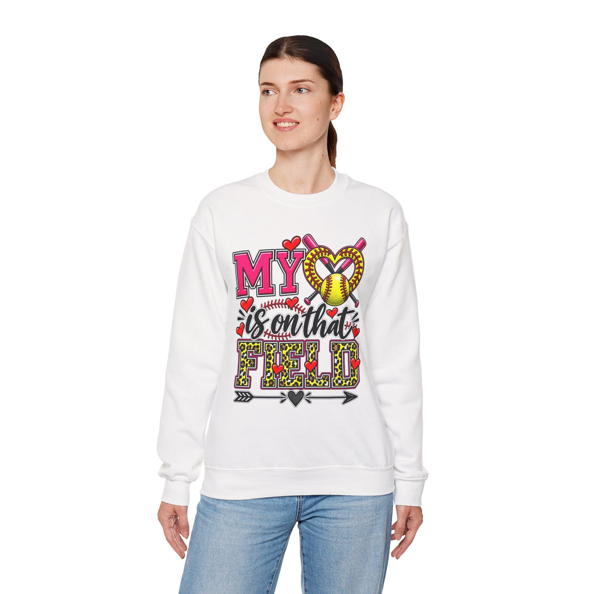 White crewneck sweatshirt on model; front graphic features hearts and softball ball