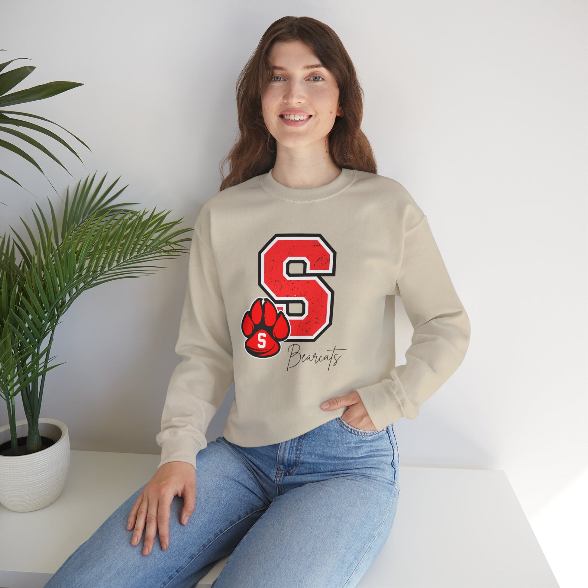 Beige crewneck sweatshirt featuring a red varsity S and paw print graphic on the chest