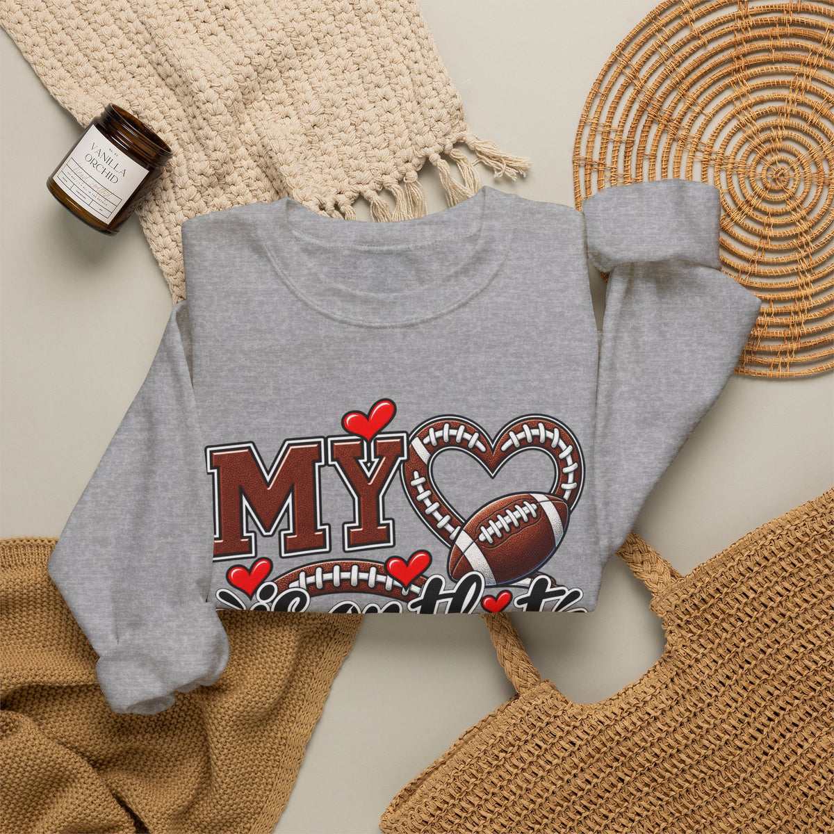 Heather gray crewneck sweatshirt with large football-heart graphic, folded