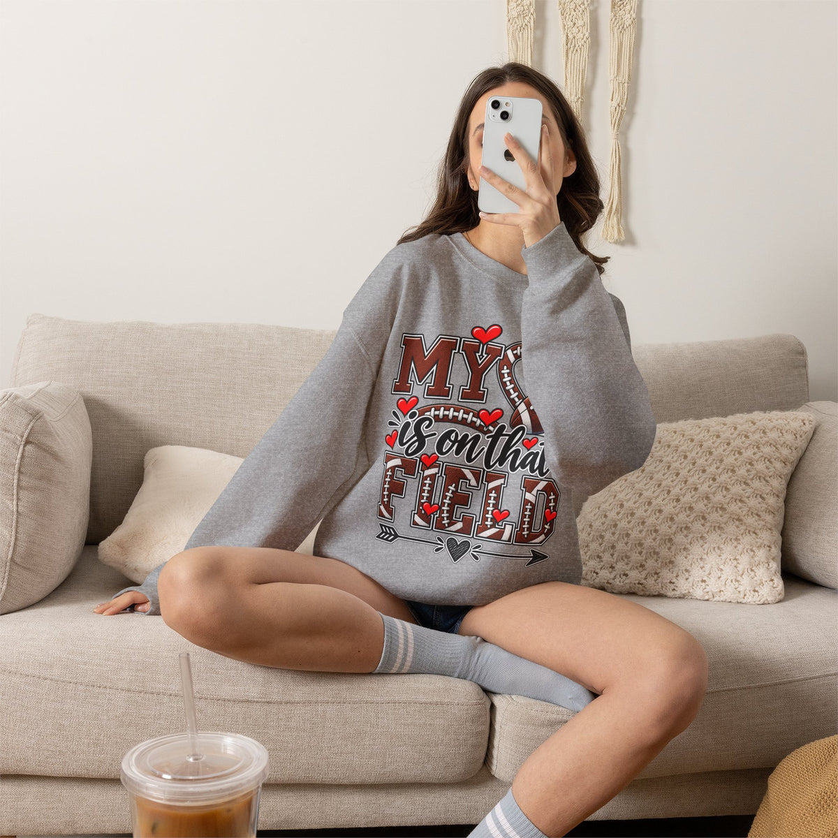 Heather gray crewneck sweatshirt with football-mom graphic print at chest