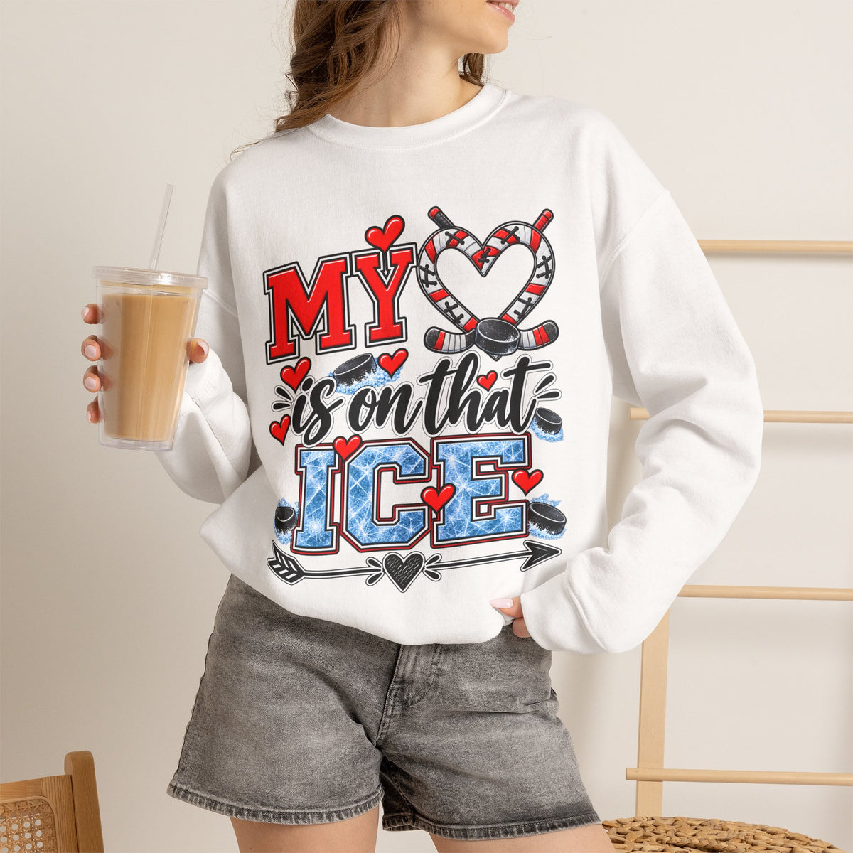 White sweatshirt worn with front ice skate and heart graphic