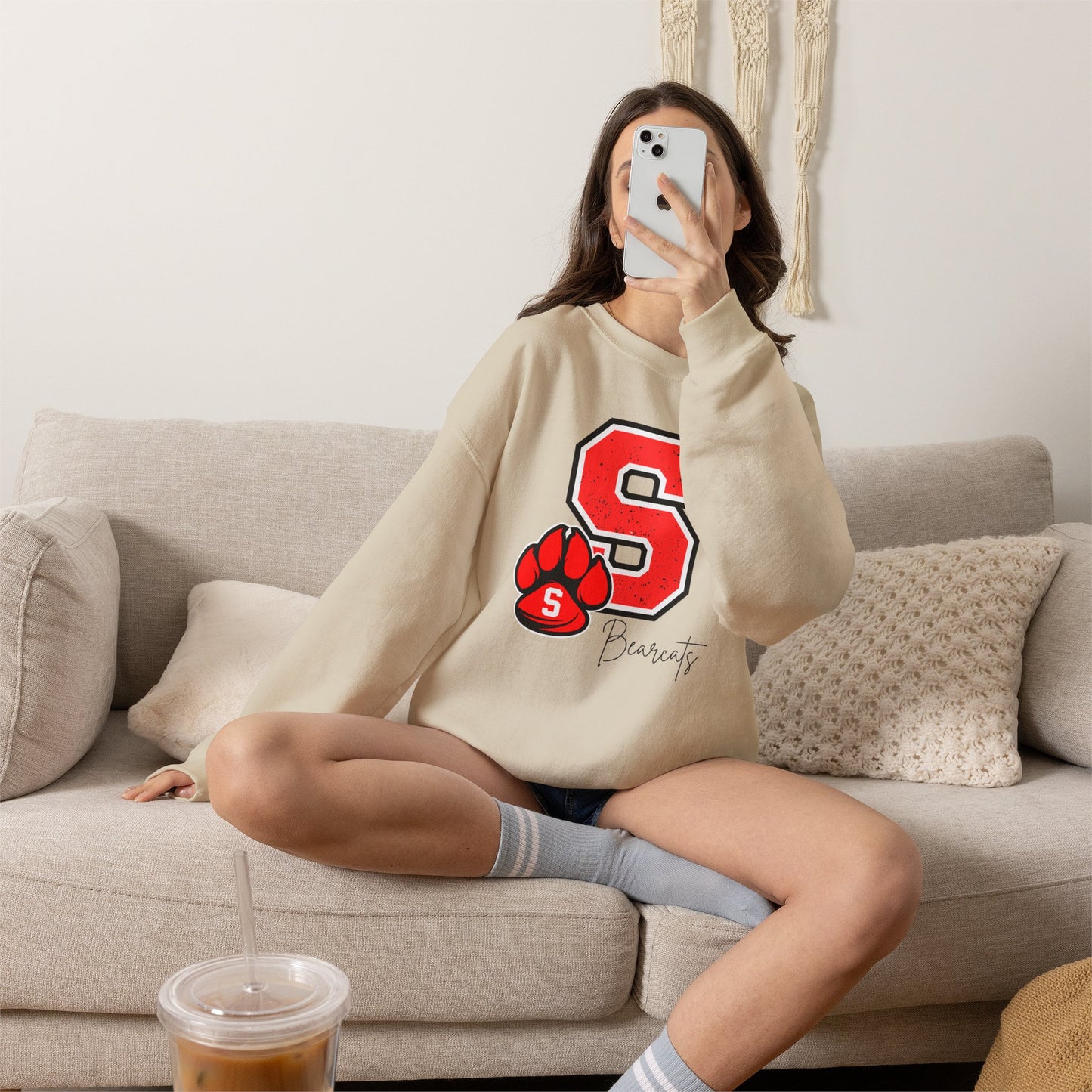 Sand crewneck sweatshirt with red S paw graphic and Bearcats logo on front