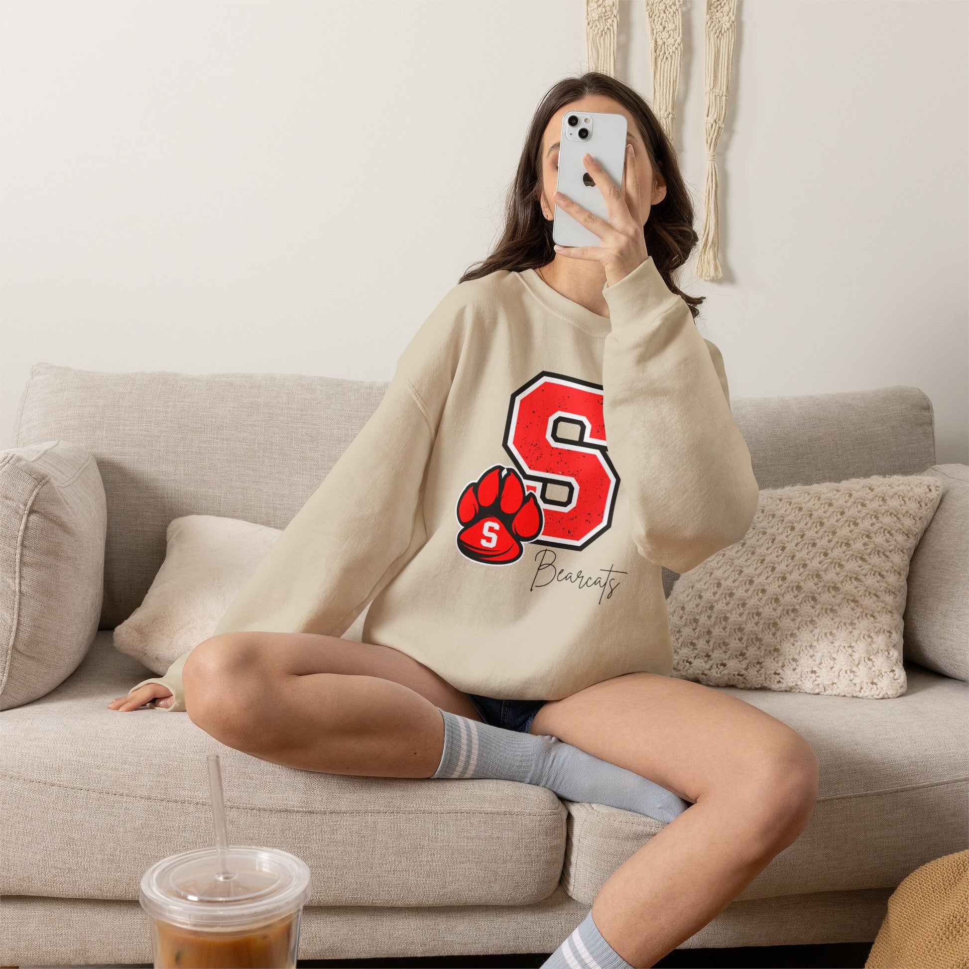 Sand crewneck sweatshirt with red S paw graphic and Bearcats logo on front