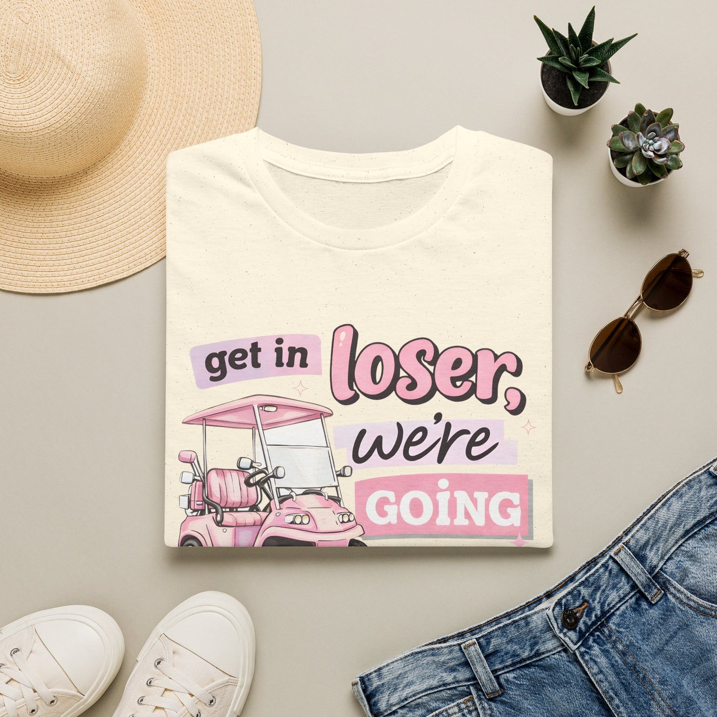 White T-shirt with large pink “Get in Loser” golf cart graphic, short sleeves