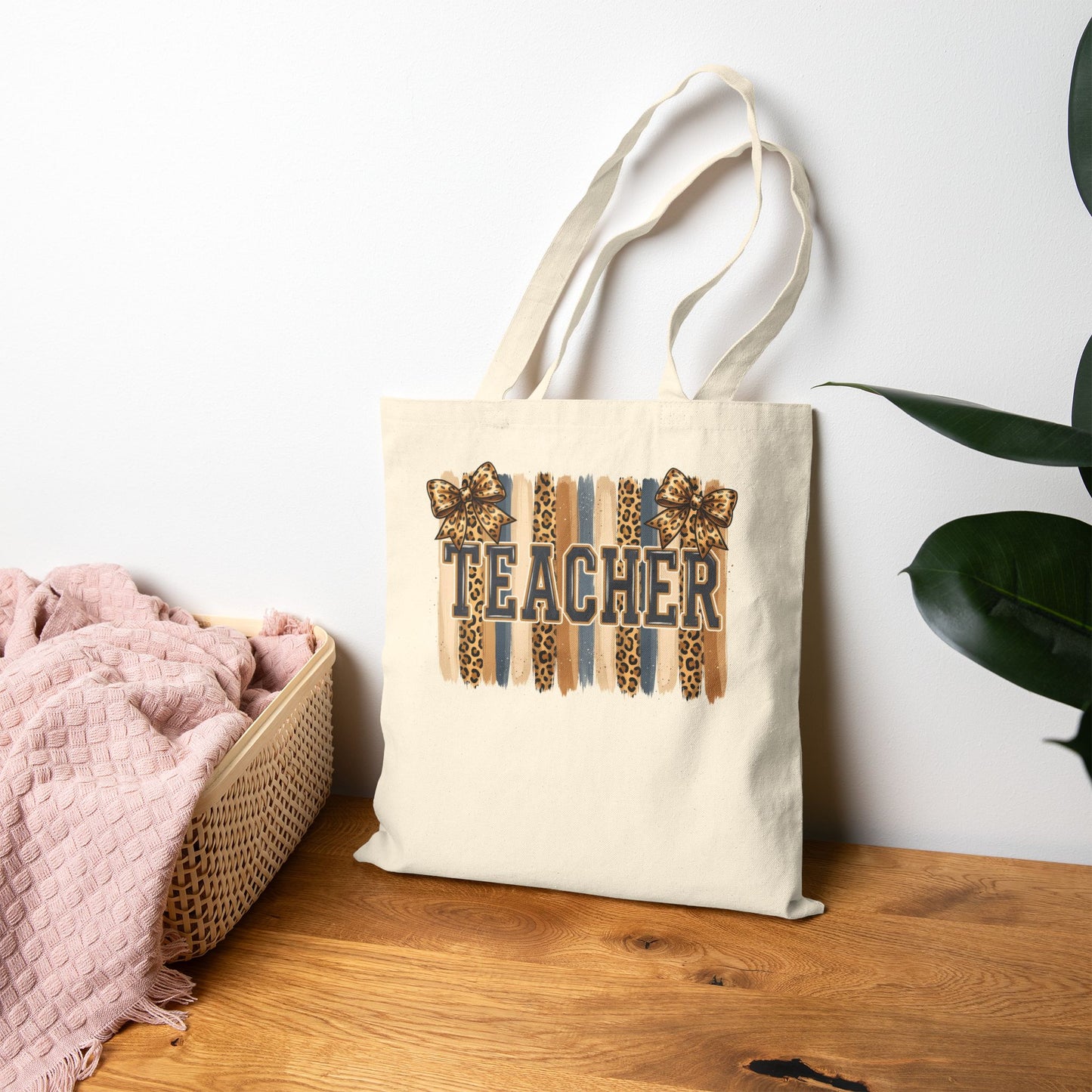 Natural canvas tote bag with leopard “Teacher” graphic, front upright
