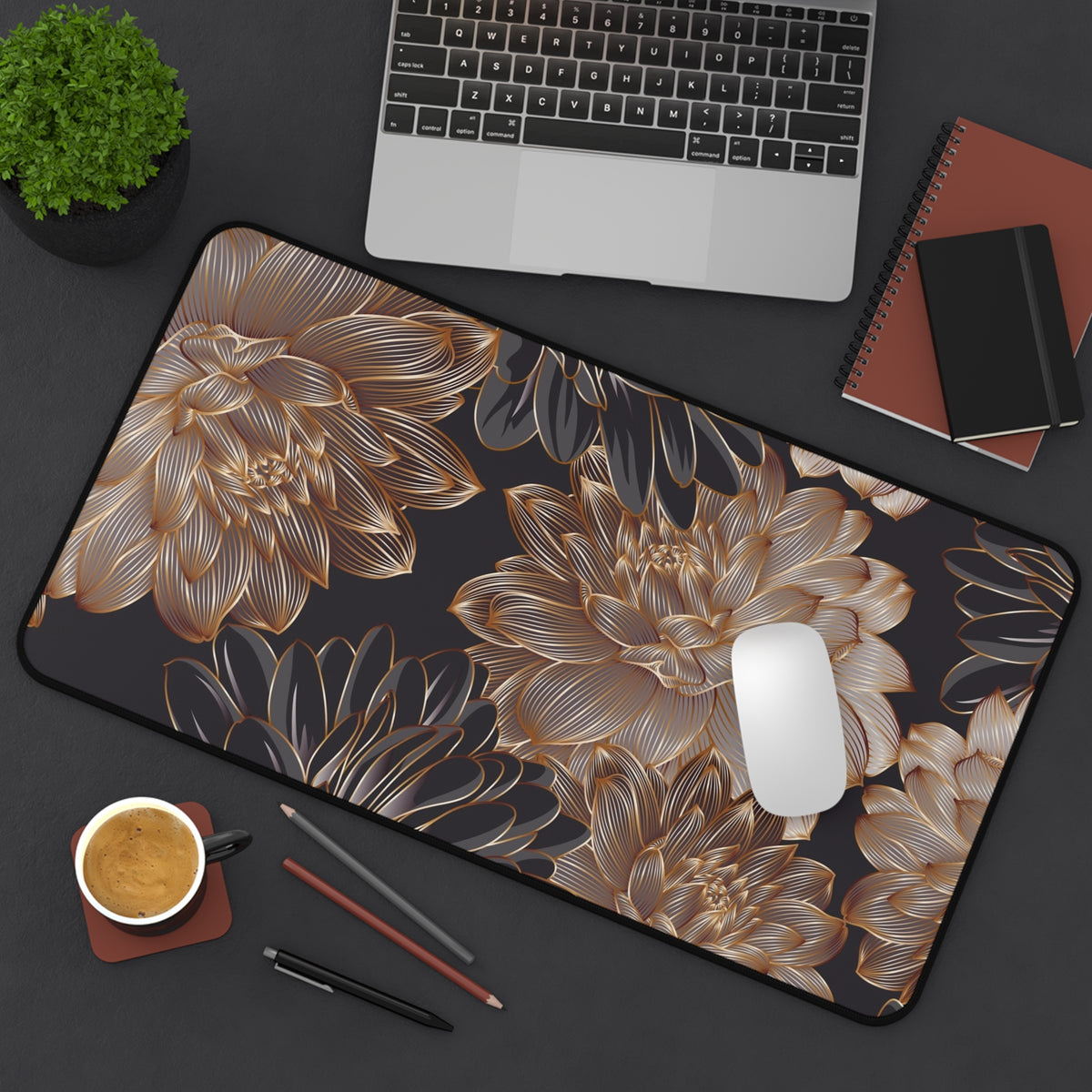 Gold floral mouse pad with dark base, corner stitching visible and rounded shape