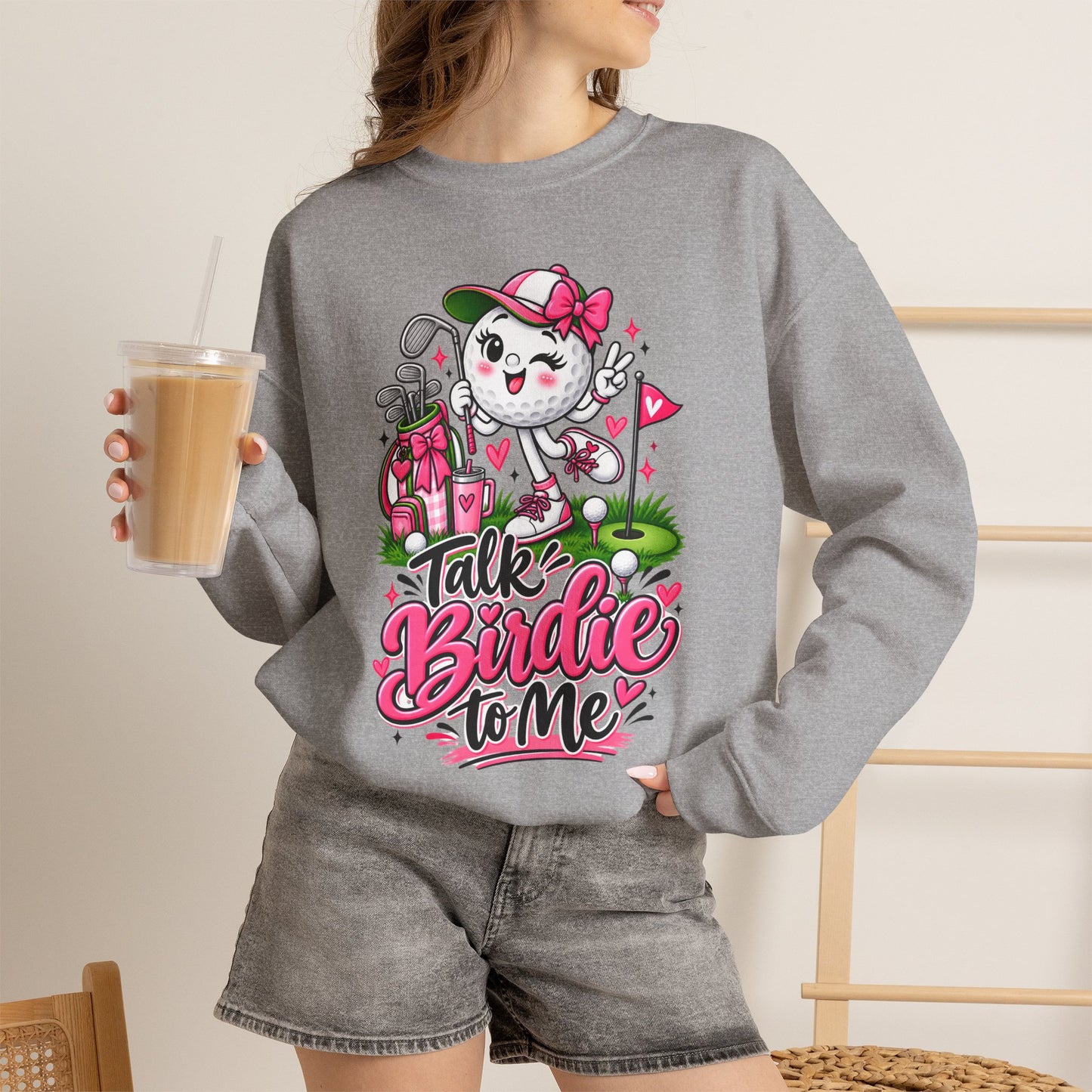 Light gray crewneck sweatshirt featuring colorful golf-ball character graphic