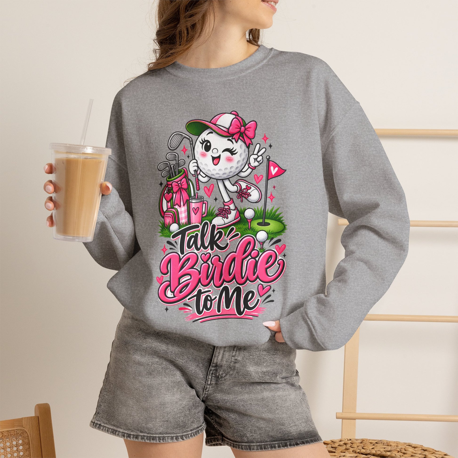 Light gray crewneck sweatshirt featuring colorful golf-ball character graphic