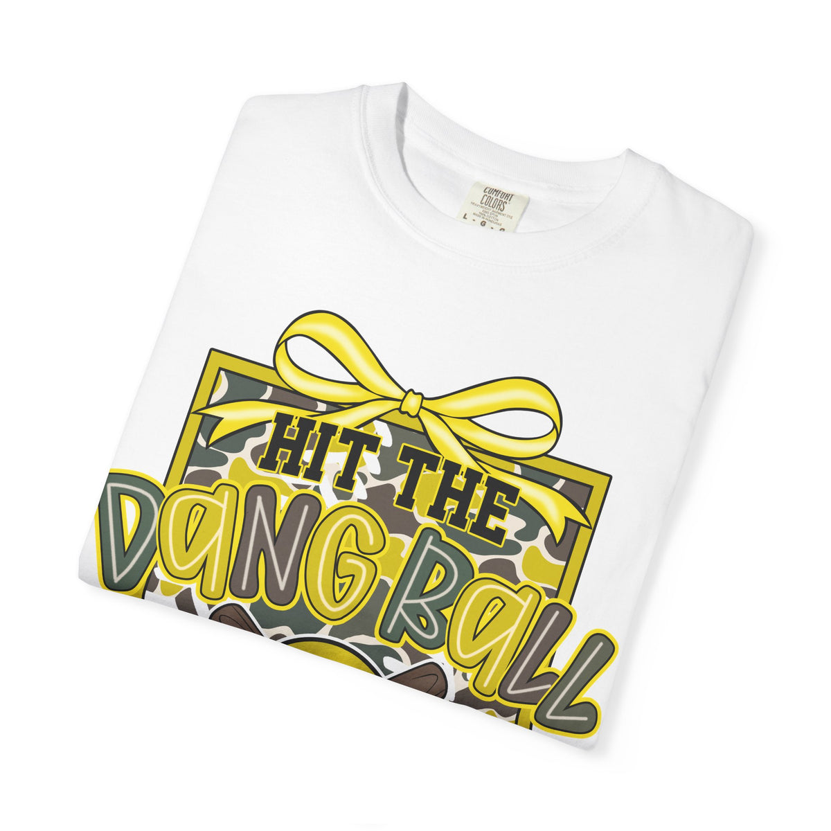 White softball graphic tee close-up with yellow bow, baseball, and 'Hit the Dang Ball' print