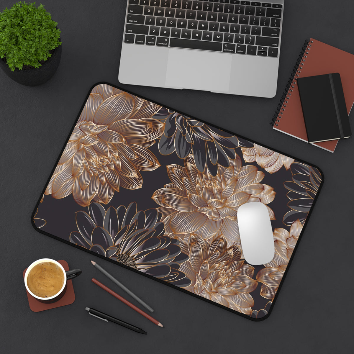 Floral desk mat with gold leaves and blossoms on dark background, suited for mouse use