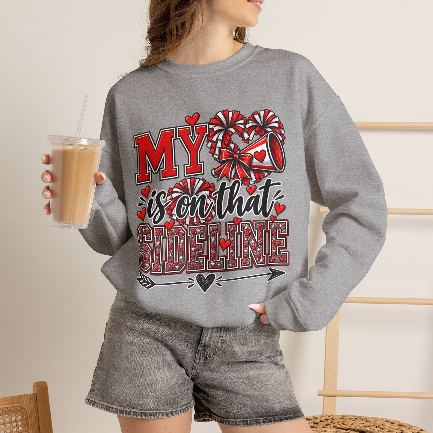Sport grey crewneck sweatshirt on model with red heart sideline graphic, long sleeves