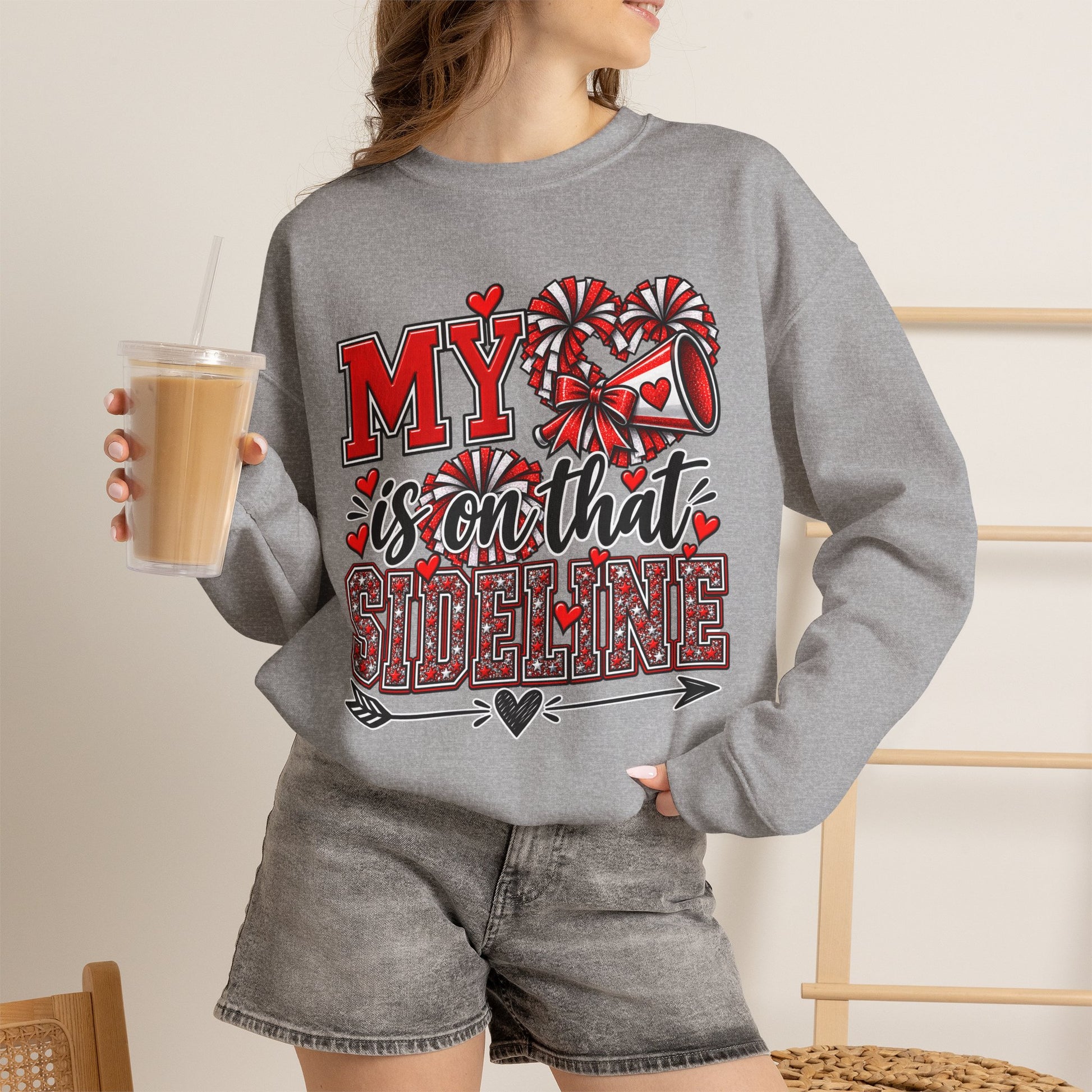 Sport grey crewneck sweatshirt on model with red heart sideline graphic, long sleeves