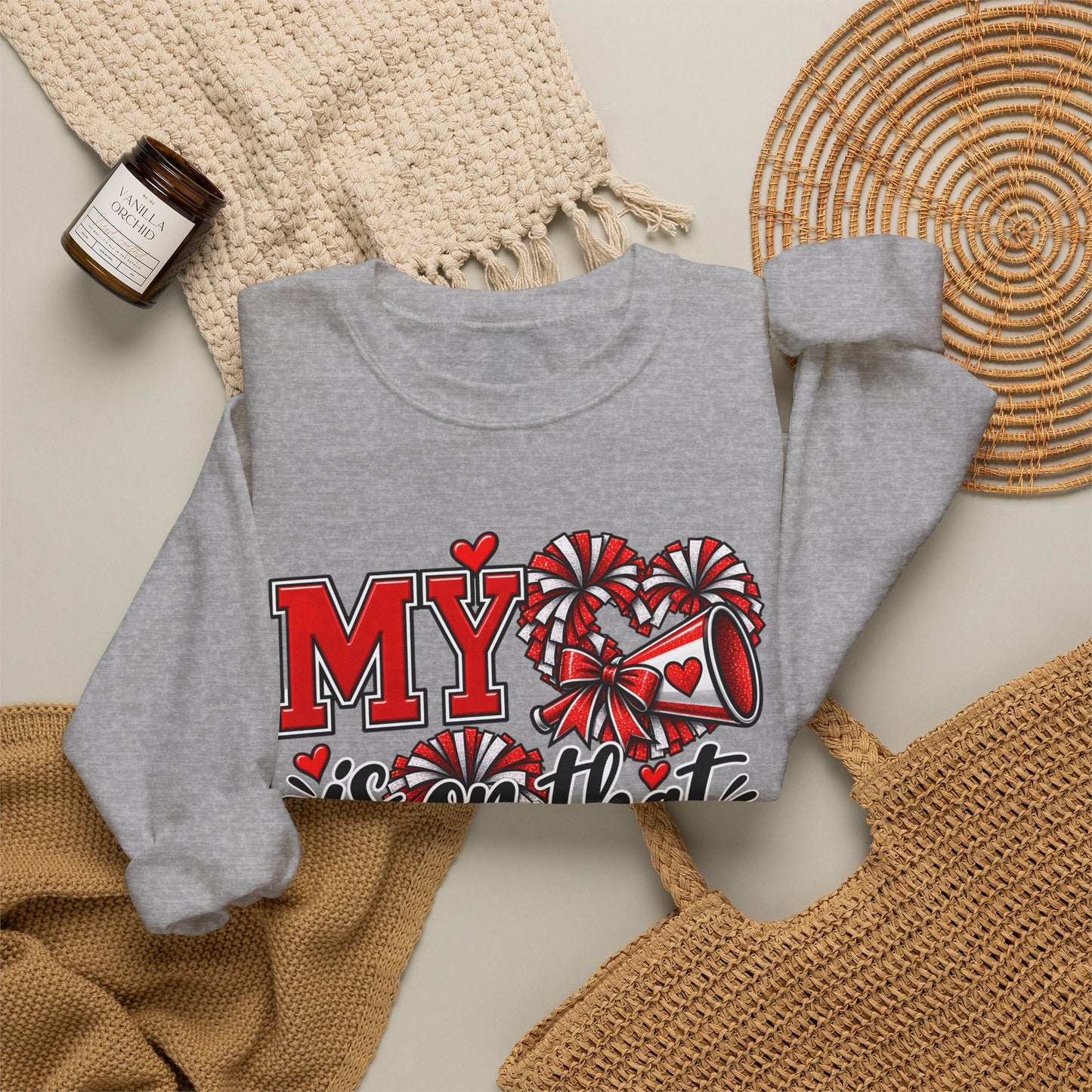 Sport grey crewneck sweatshirt with red heart sideline graphic, front close-up