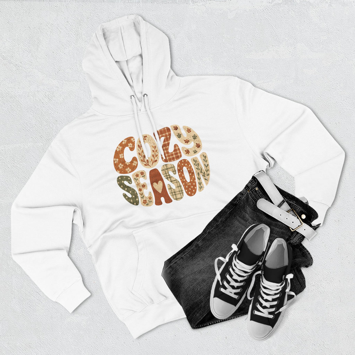 White fleece pullover hoodie with “COZY SEASON” leopard-style graphic on front