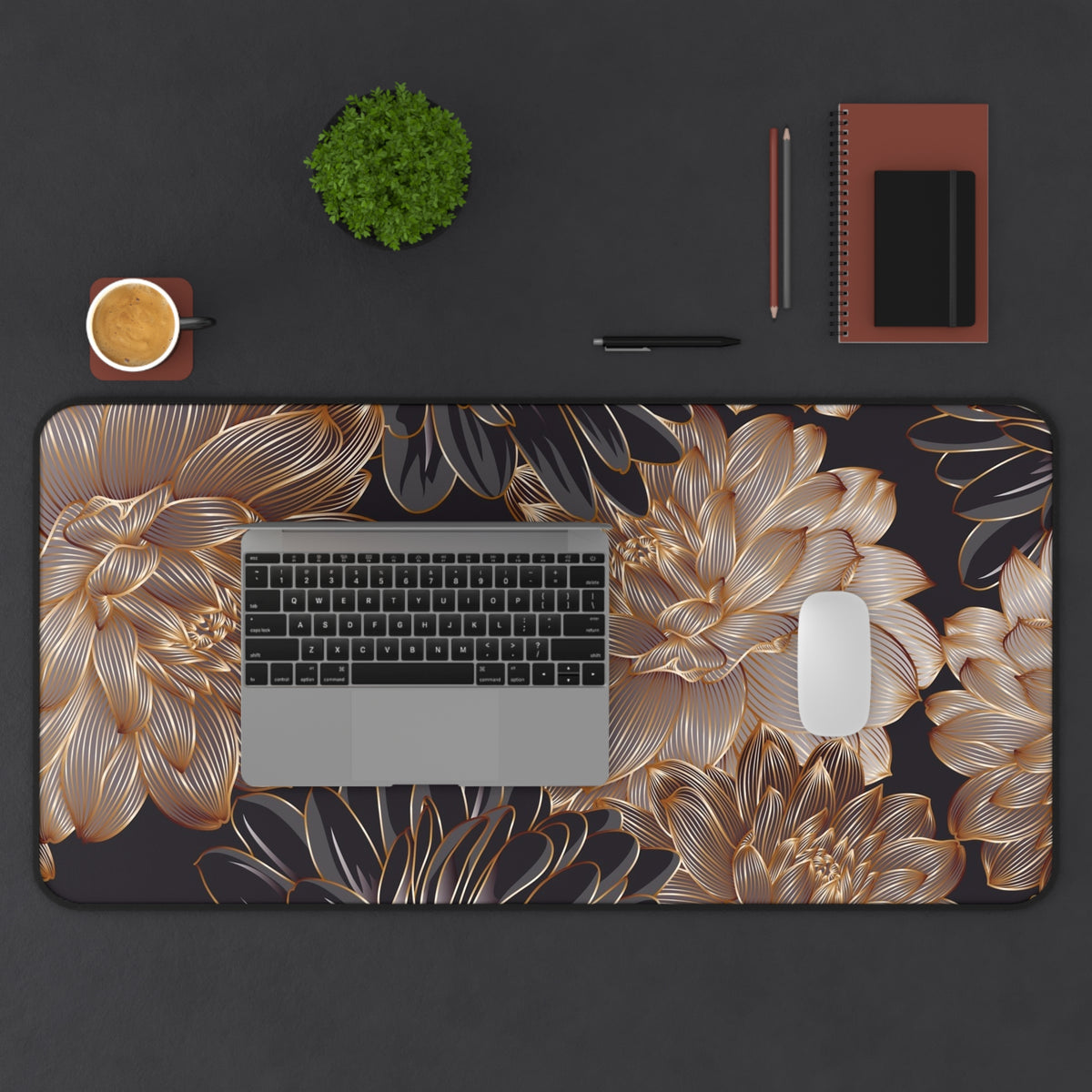 Large desk mat with gold floral leaf print, curved corners, and stitched border