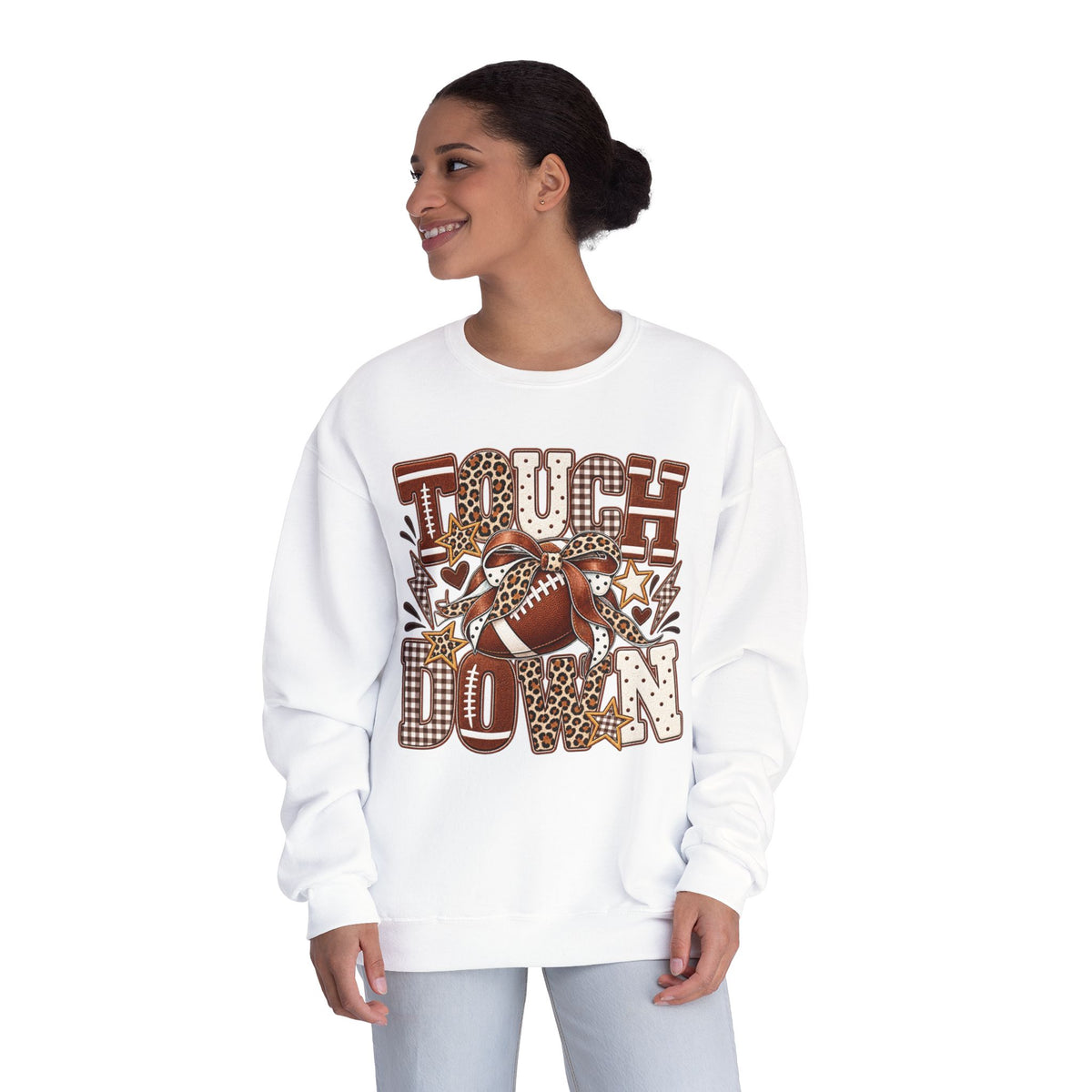 White crewneck sweatshirt on model, front view with brown football “Touchdown” graphic
