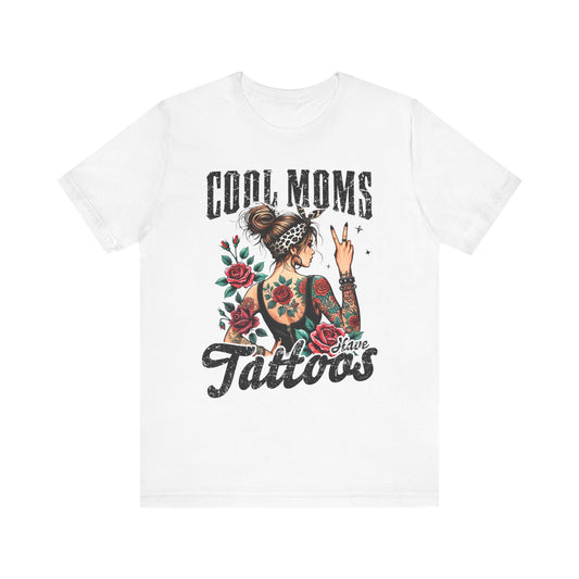 White unisex short sleeve jersey tee with front “Cool Moms Tattoos” graphic