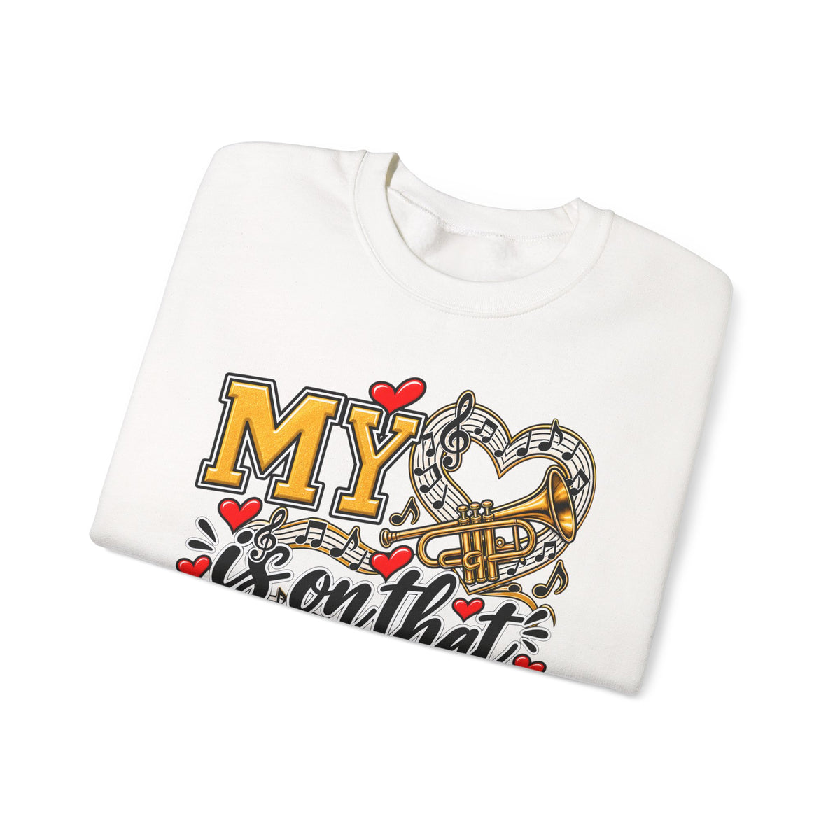 White sweatshirt folded showing heart and trumpet marching-band graphic