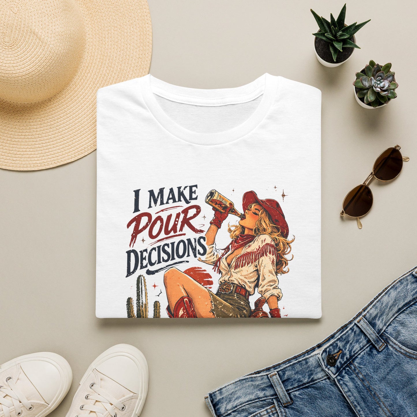 White cowgirl T-shirt laid flat with retro western cowgirl “I Make Pour Decisions” print