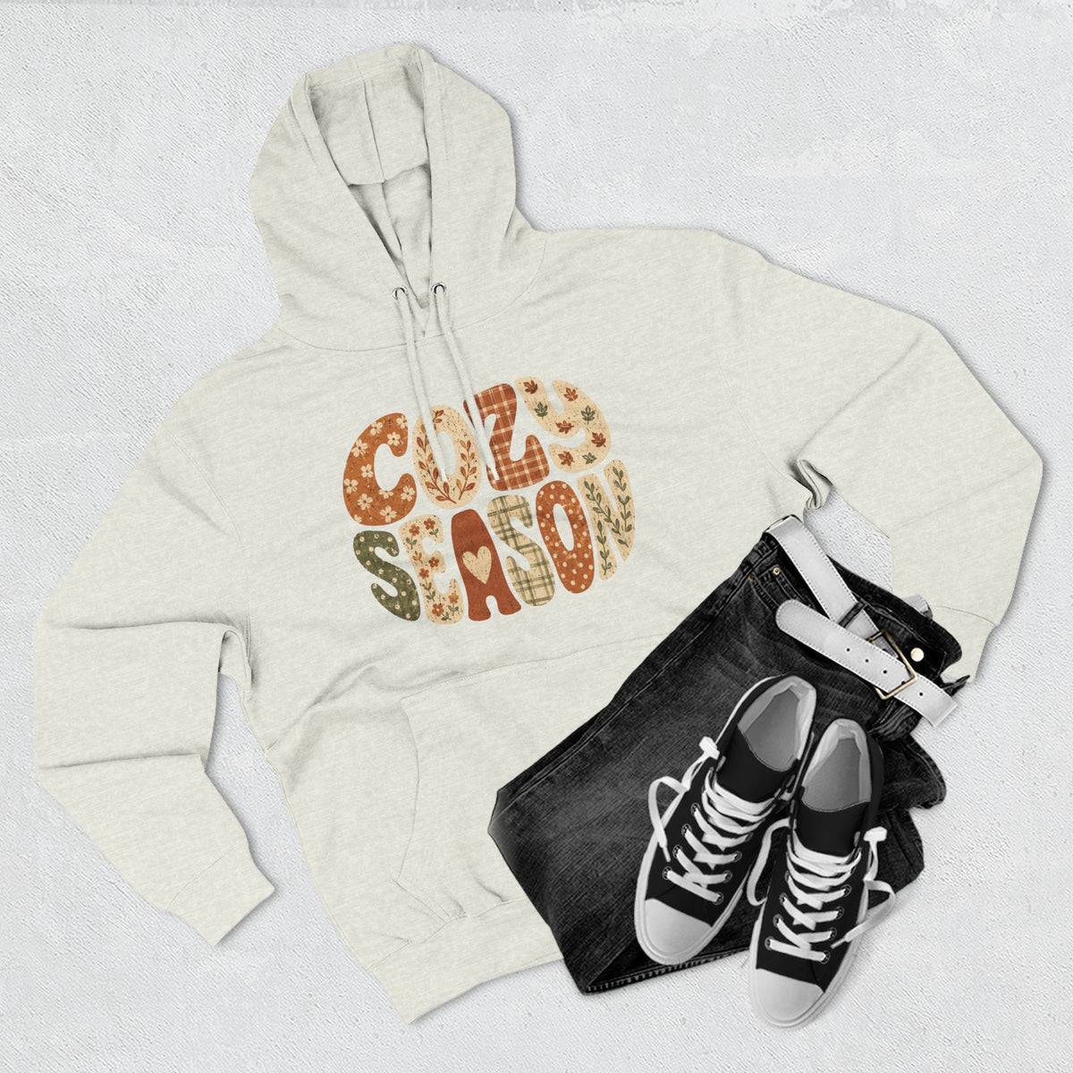 Oatmeal heather fleece pullover hoodie with “COZY SEASON” leopard-style graphic on front