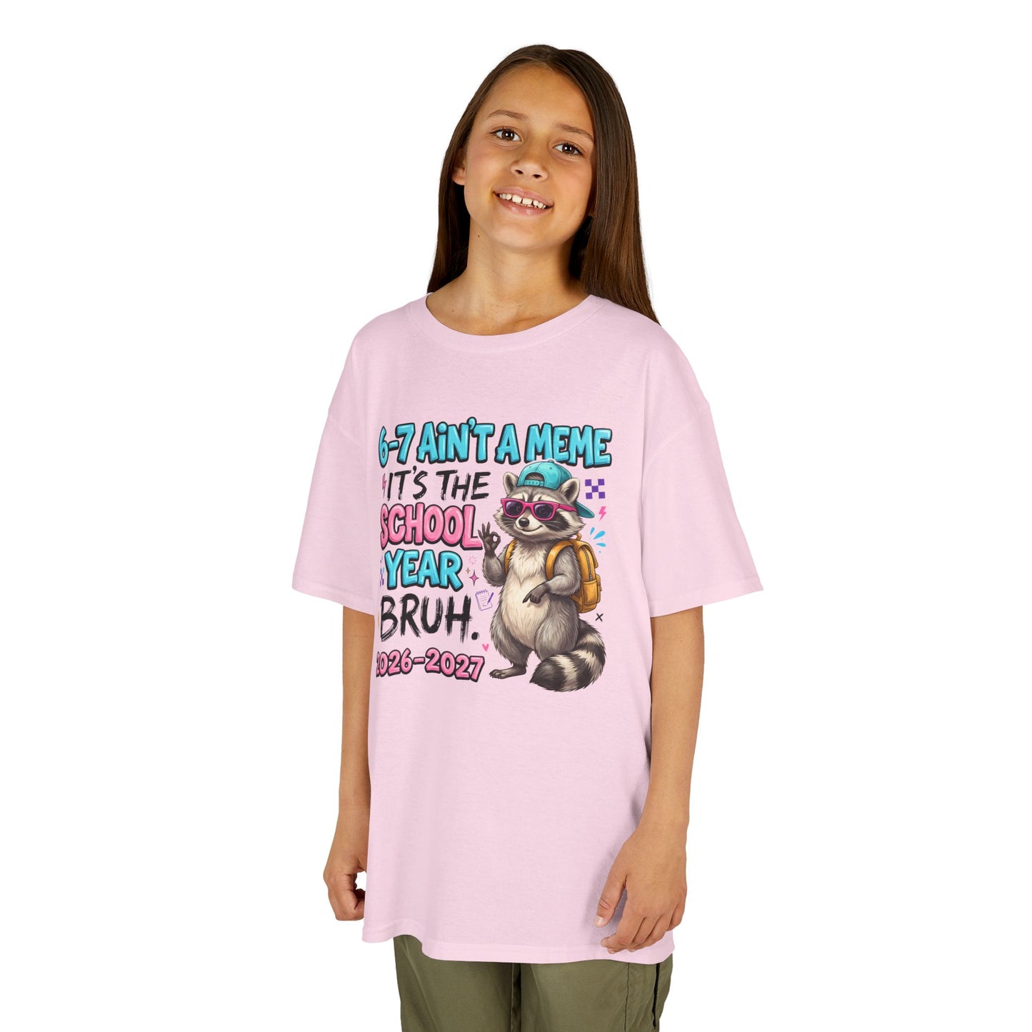 Light pink kids graphic T-shirt with raccoon backpack meme print, worn by child