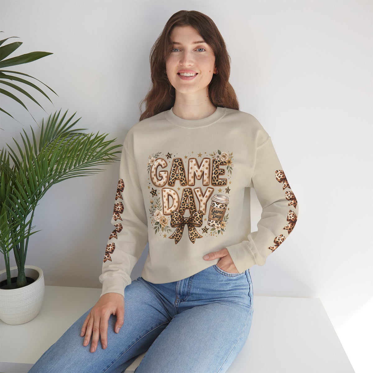 Sand crewneck sweatshirt on model with 'GAME DAY' leopard bow and star details