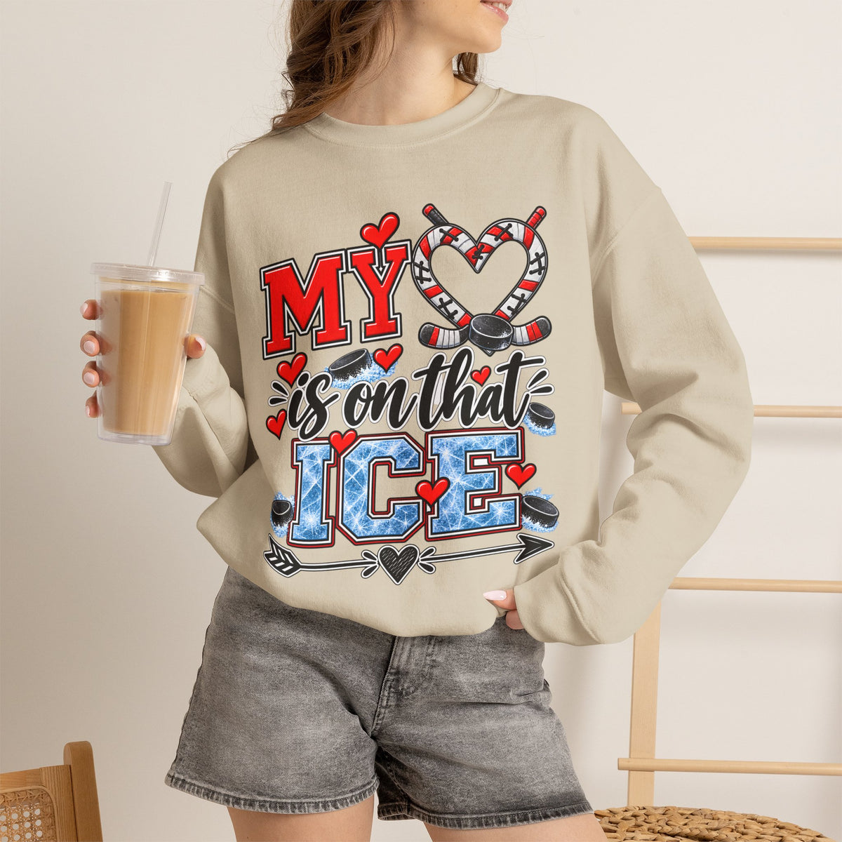 Sand sweatshirt worn with front ice skate and heart graphic