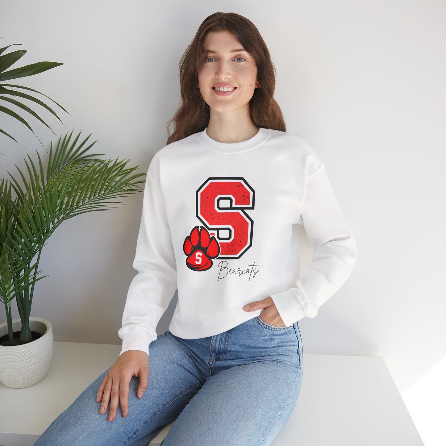 White crewneck sweatshirt with red S paw graphic and Bearcats logo on front