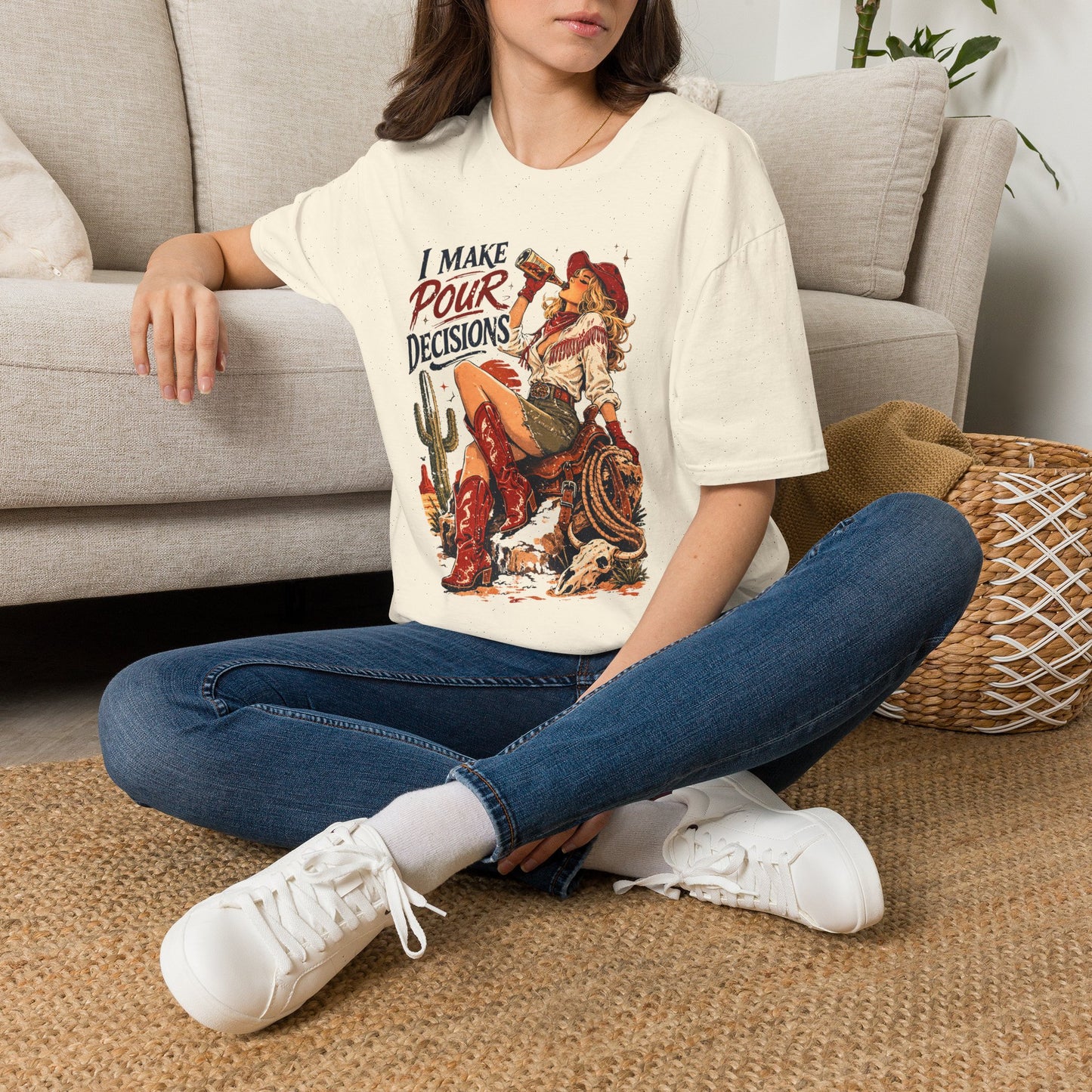 Natural cowgirl T-shirt worn by a woman with retro western “I Make Pour Decisions” print