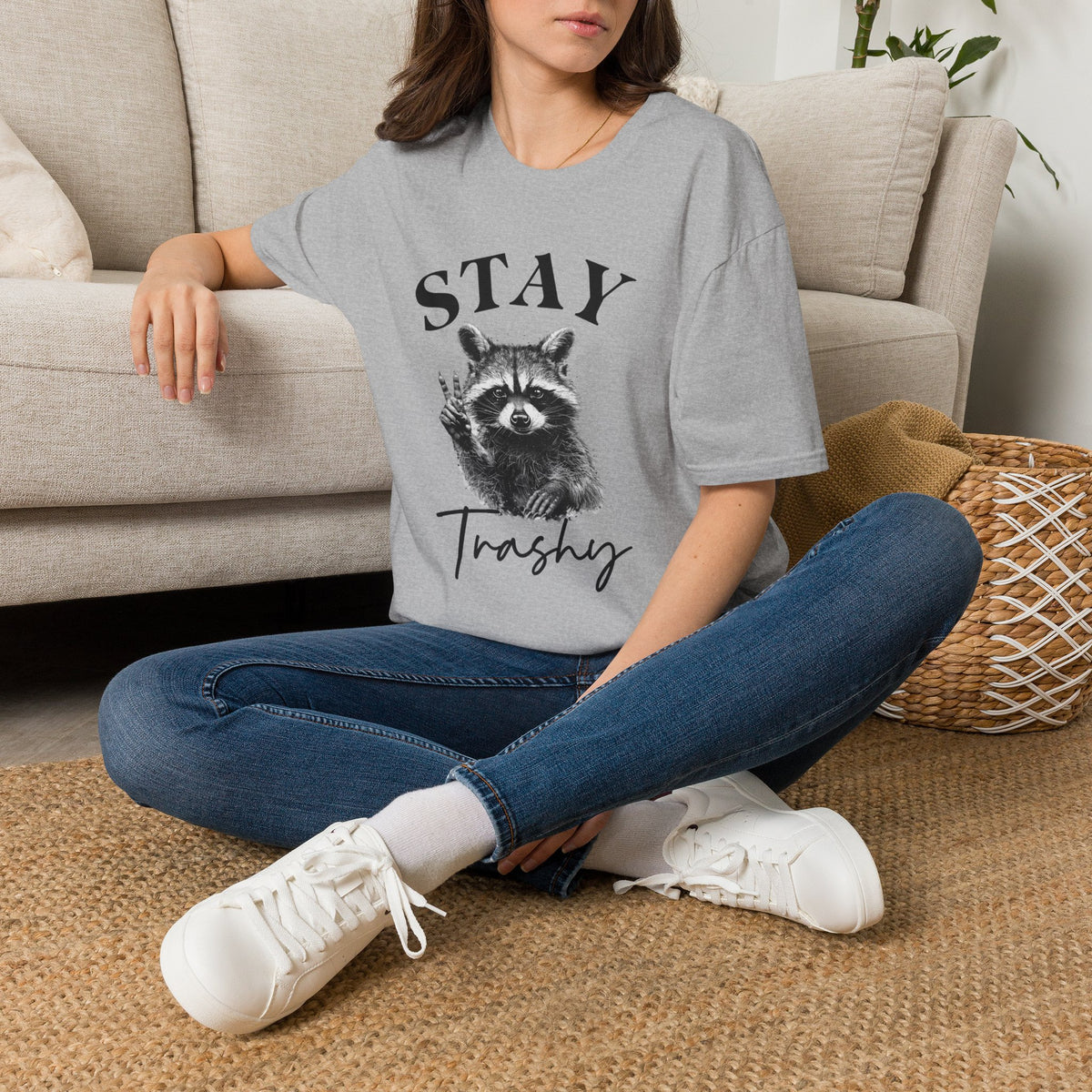 Sport grey raccoon graphic T-shirt worn by model with “STAY” and “Trashy”